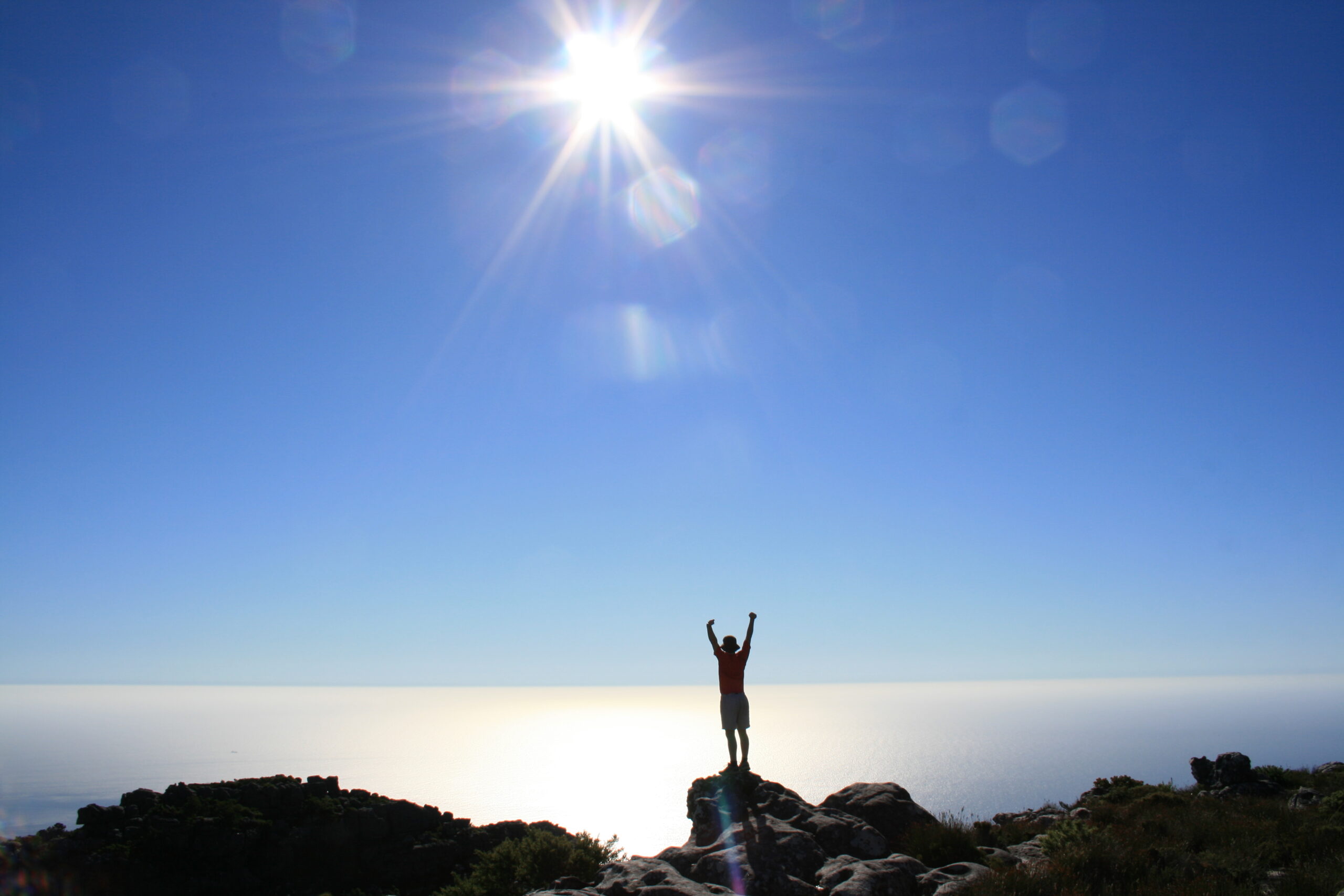 My brother stands at the top of Table Mountain in Cape Town, South Africa.