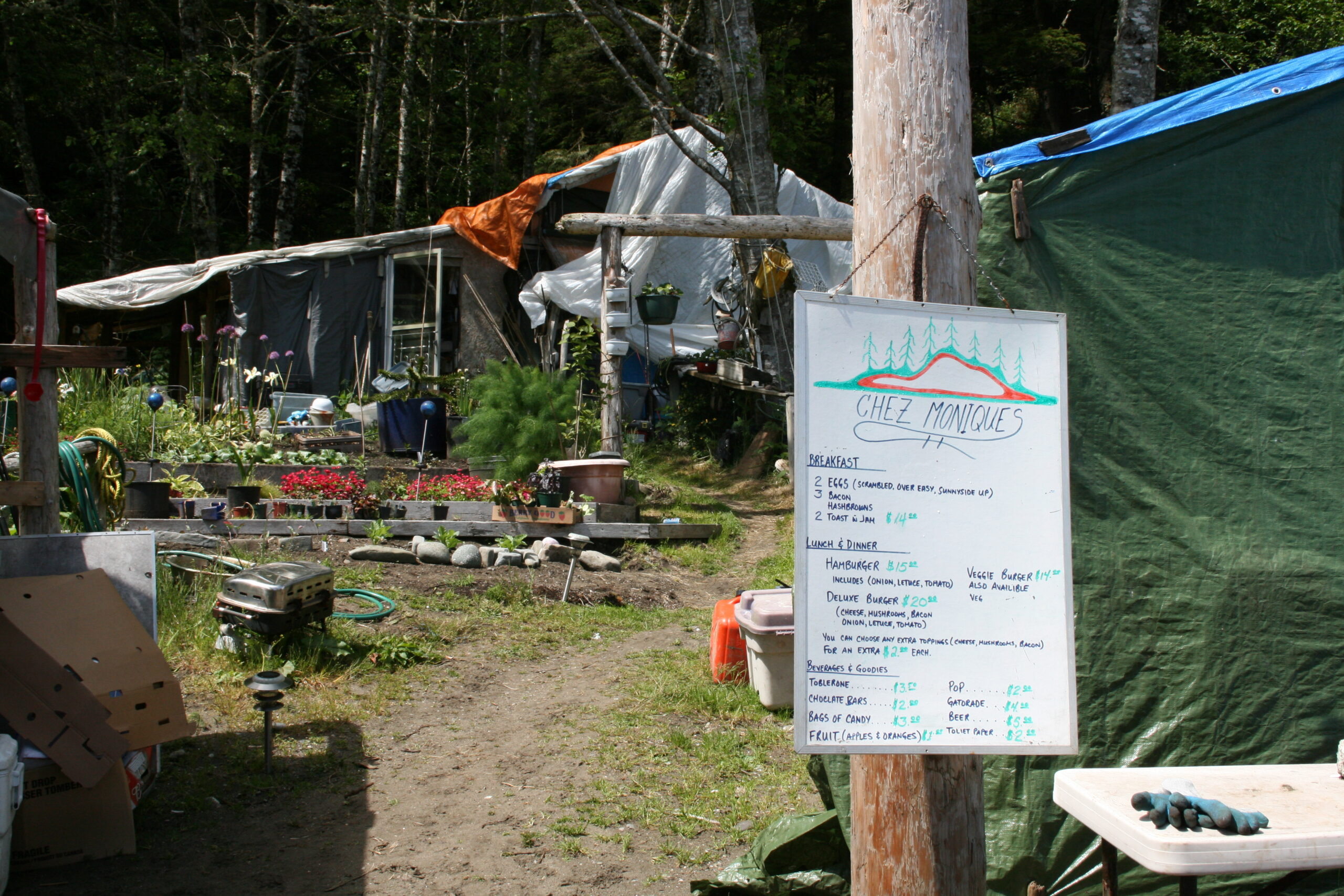 The menu and tarps at Chez Monique