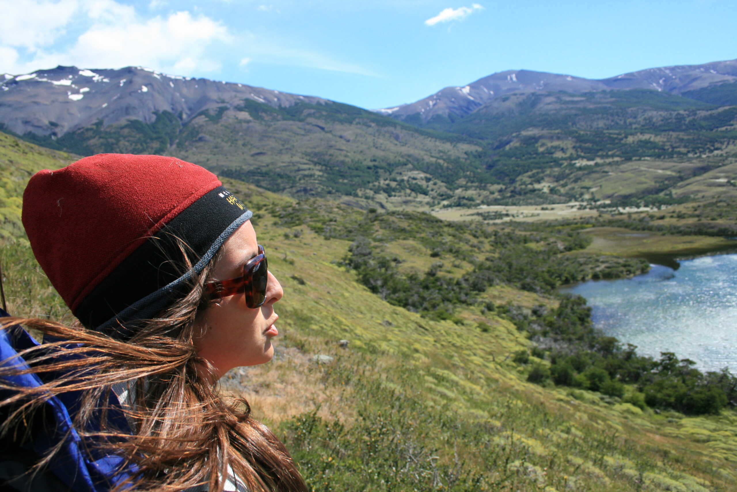 A Chilean hiker looks out at Lago Paine on the Torres del Paine Circuit.