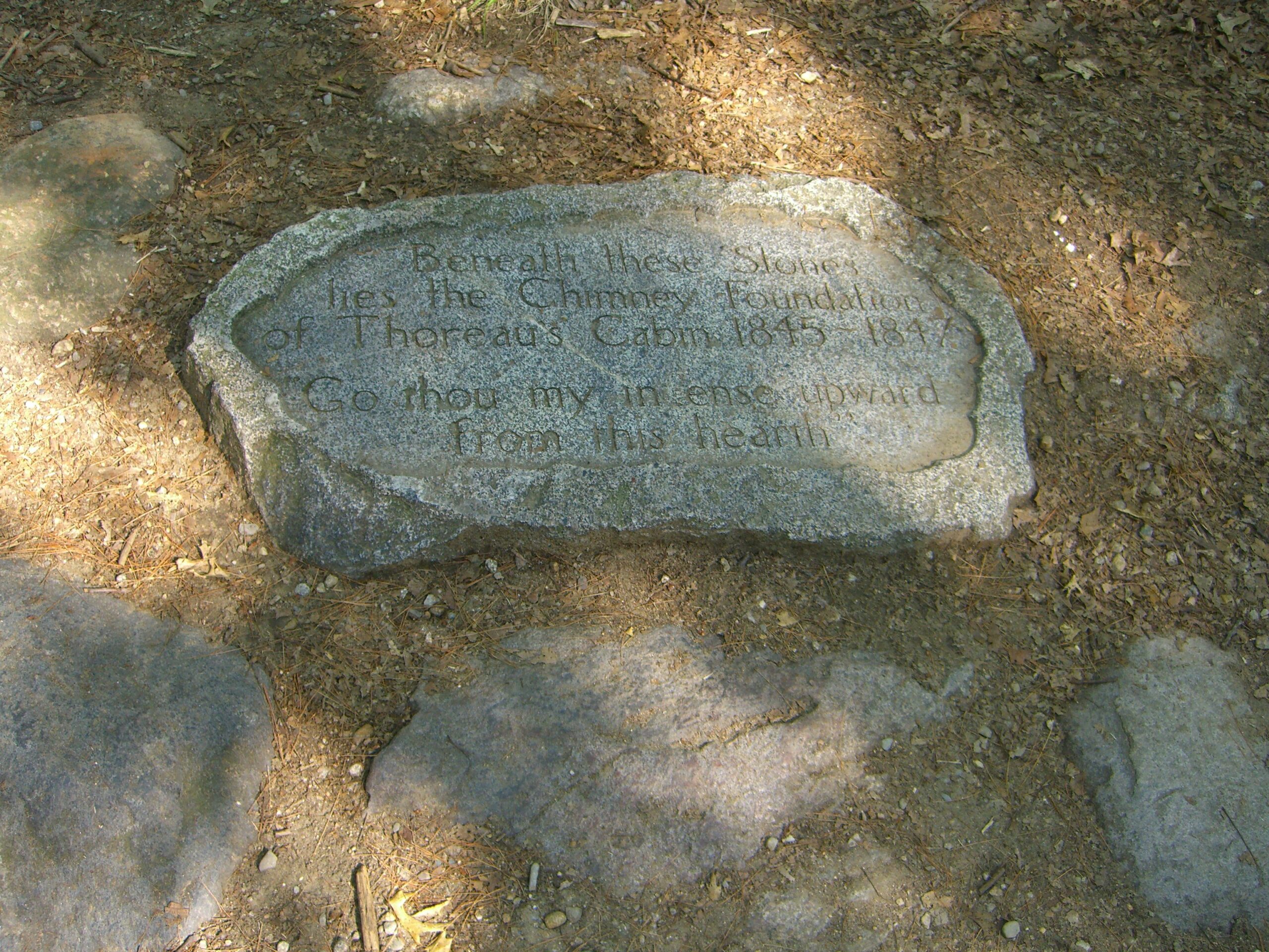A stone marks the original site of Thoreau's cabin near Walden Pond.