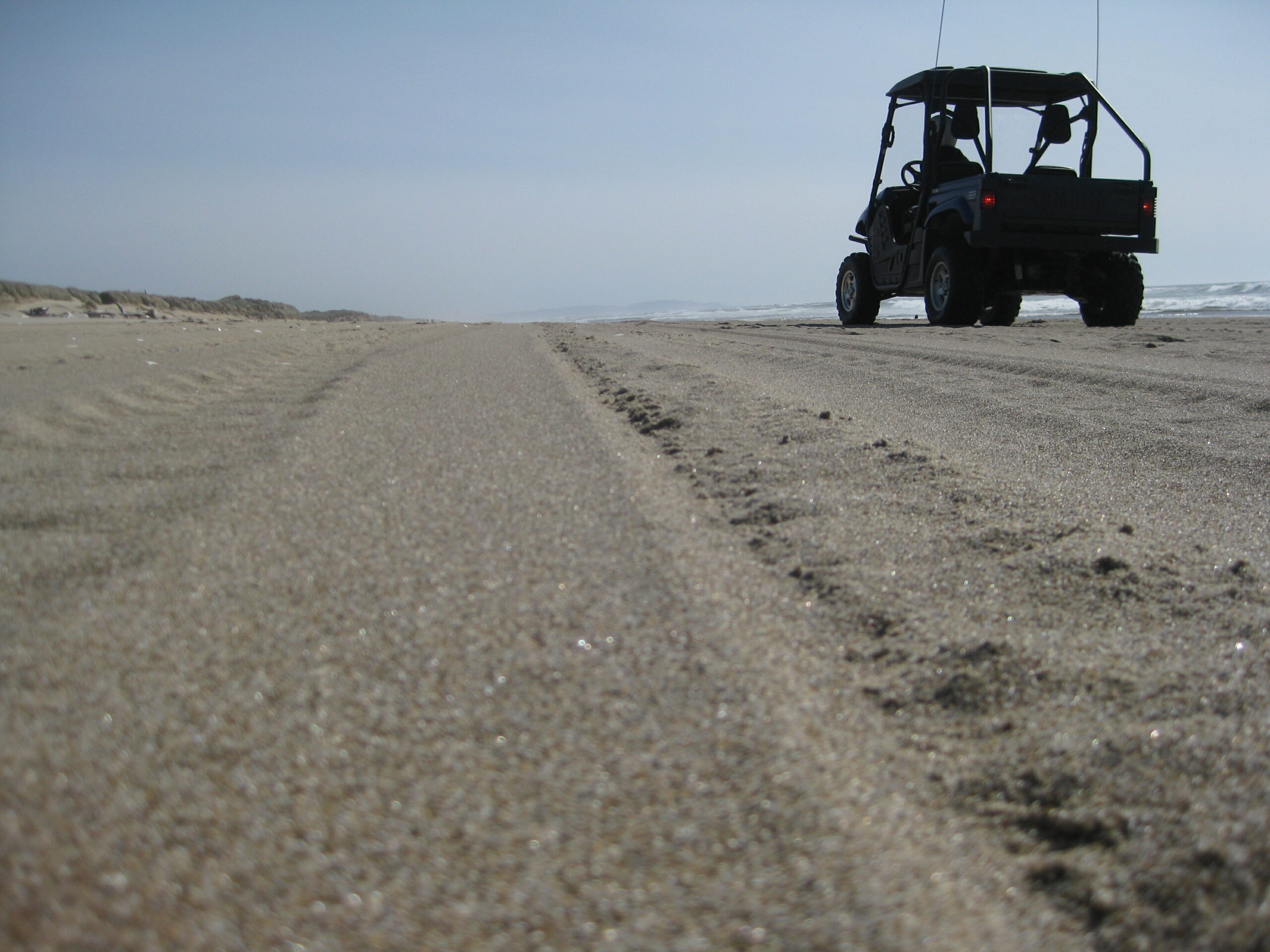 A Yamaha Rhino sits on a beach in southern Oregon.