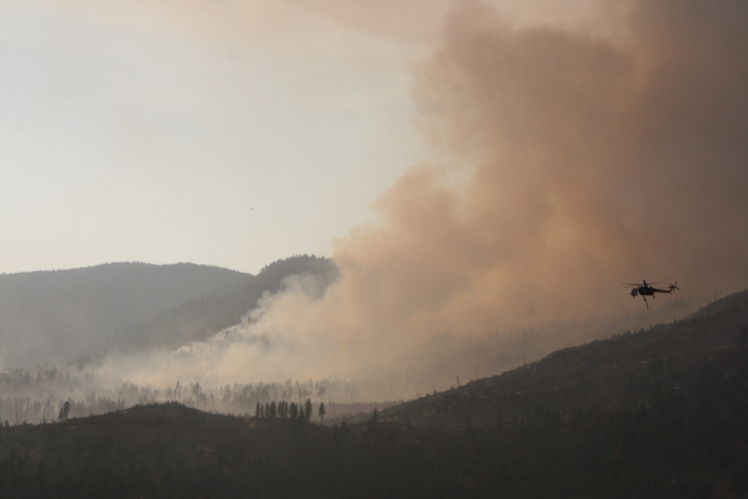 Big Meadows Fire burning with helicopter