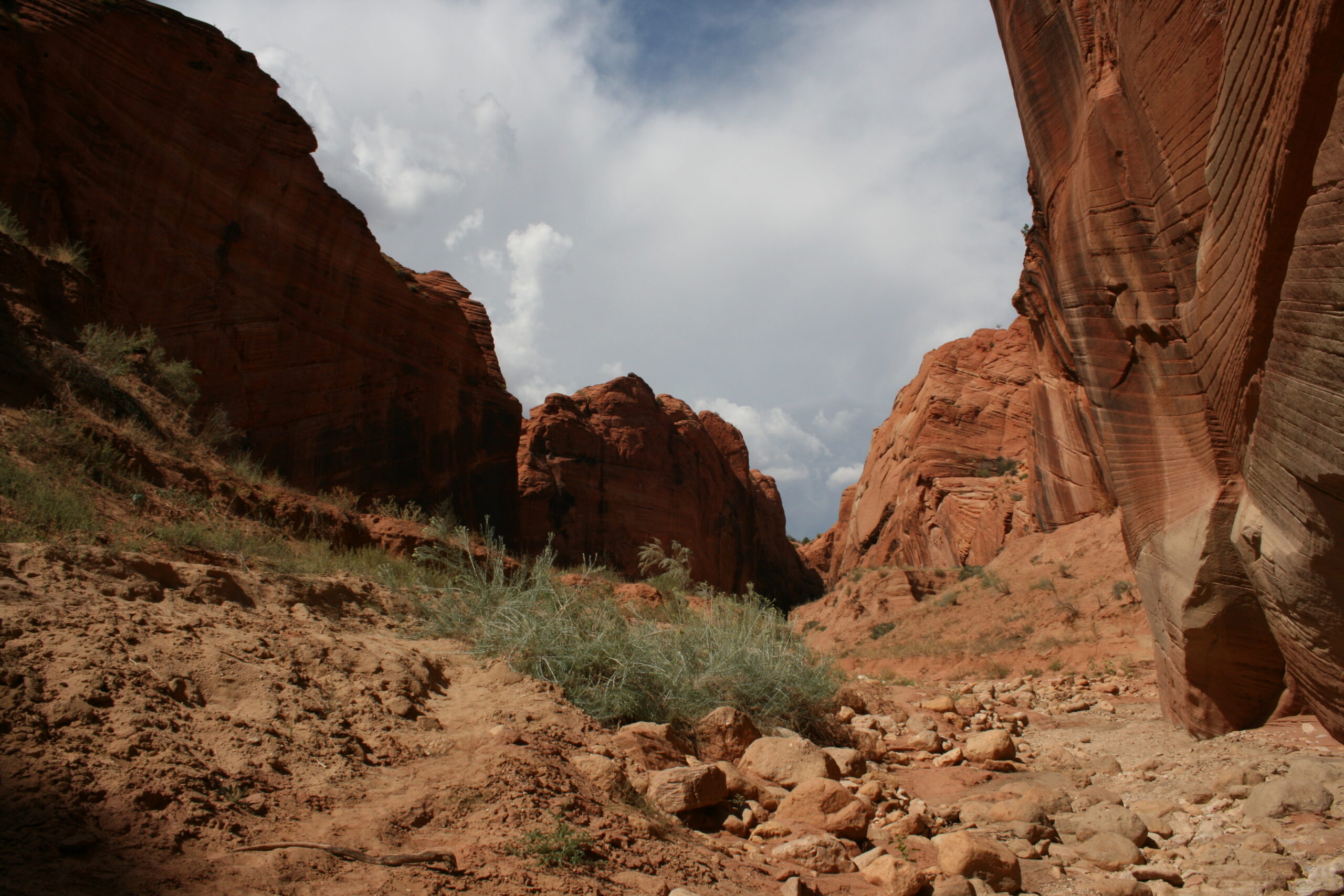 Ominous clouds appear overhead while hiking near Wire Pass.