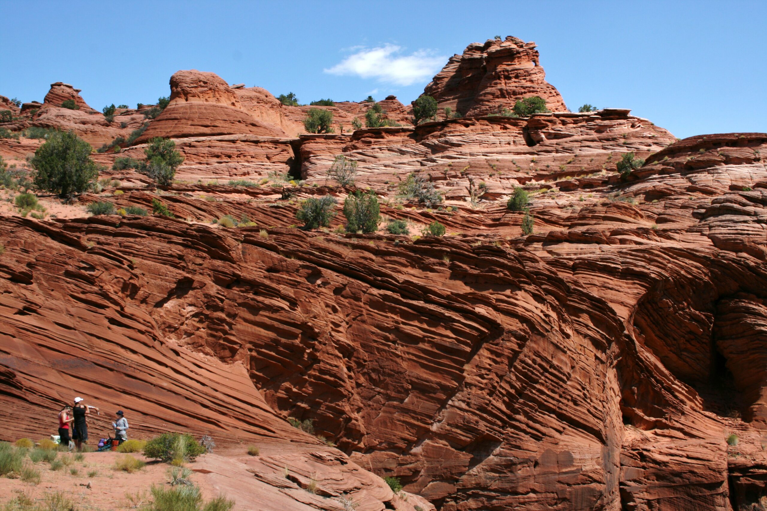The group rests above Buckskin Gulch after climbing out of the canyon.