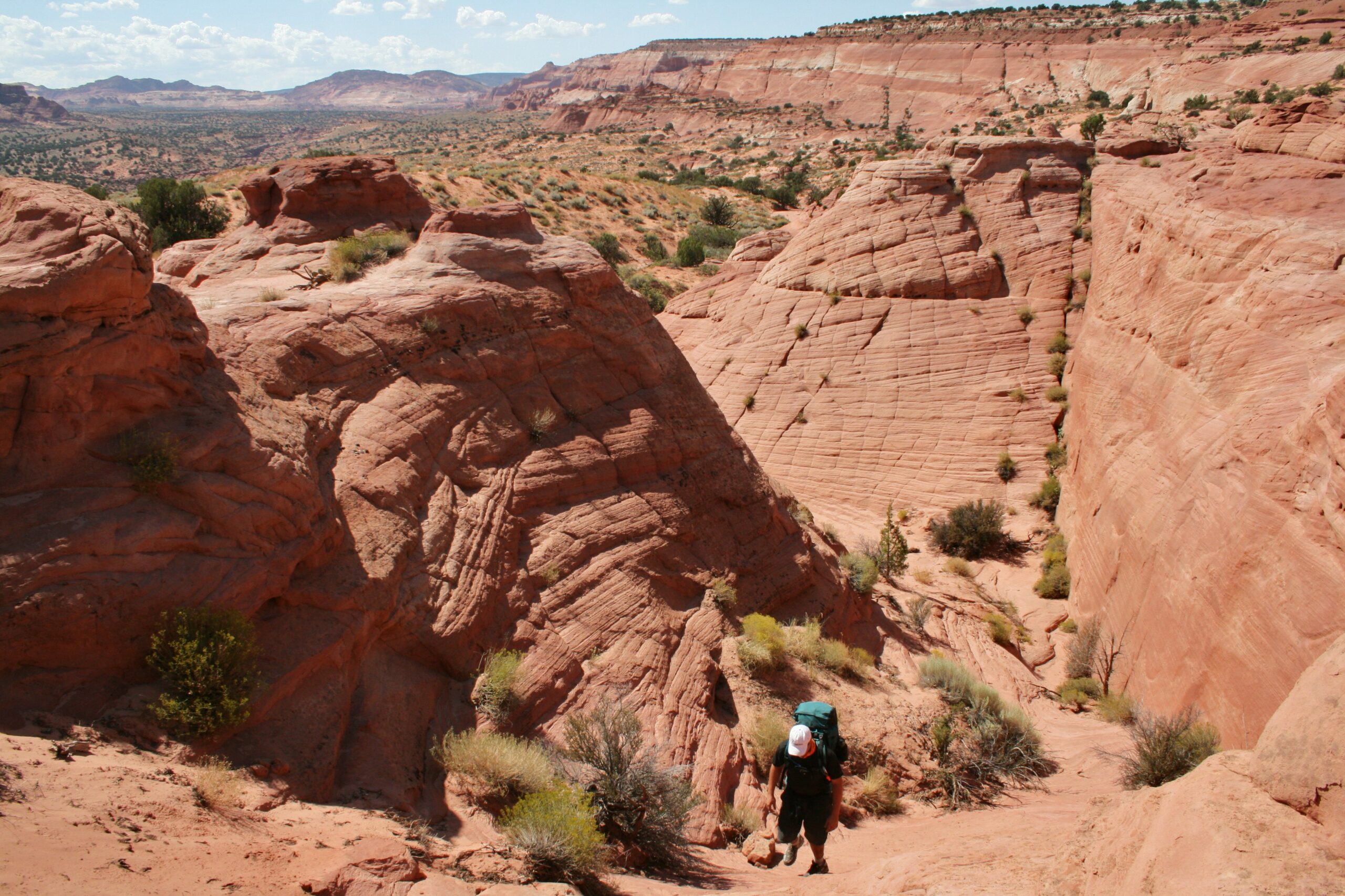 A hiker traverses Middle Route near The Dive.
