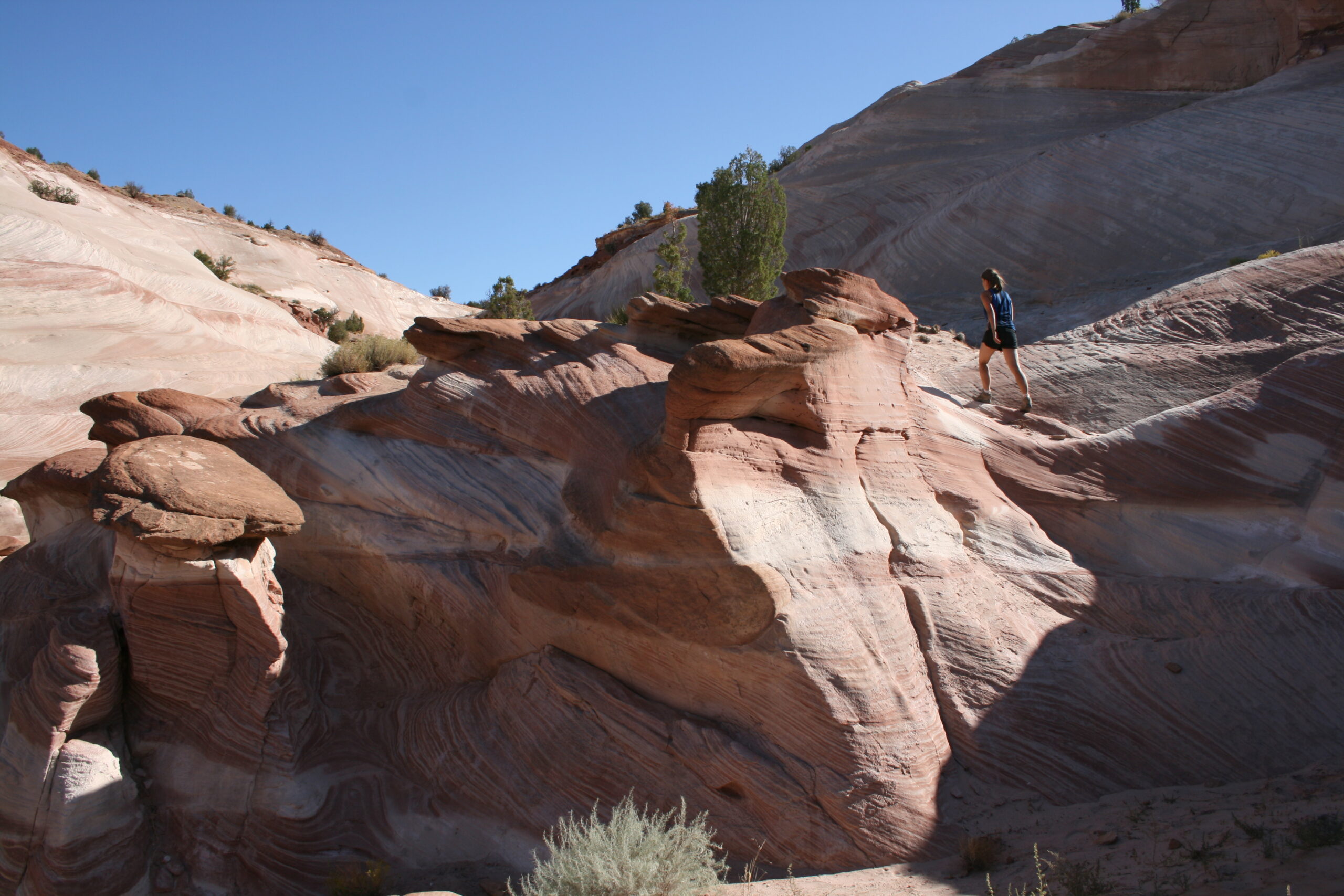 Wini hikes up rock formations near the White House Trailhead.