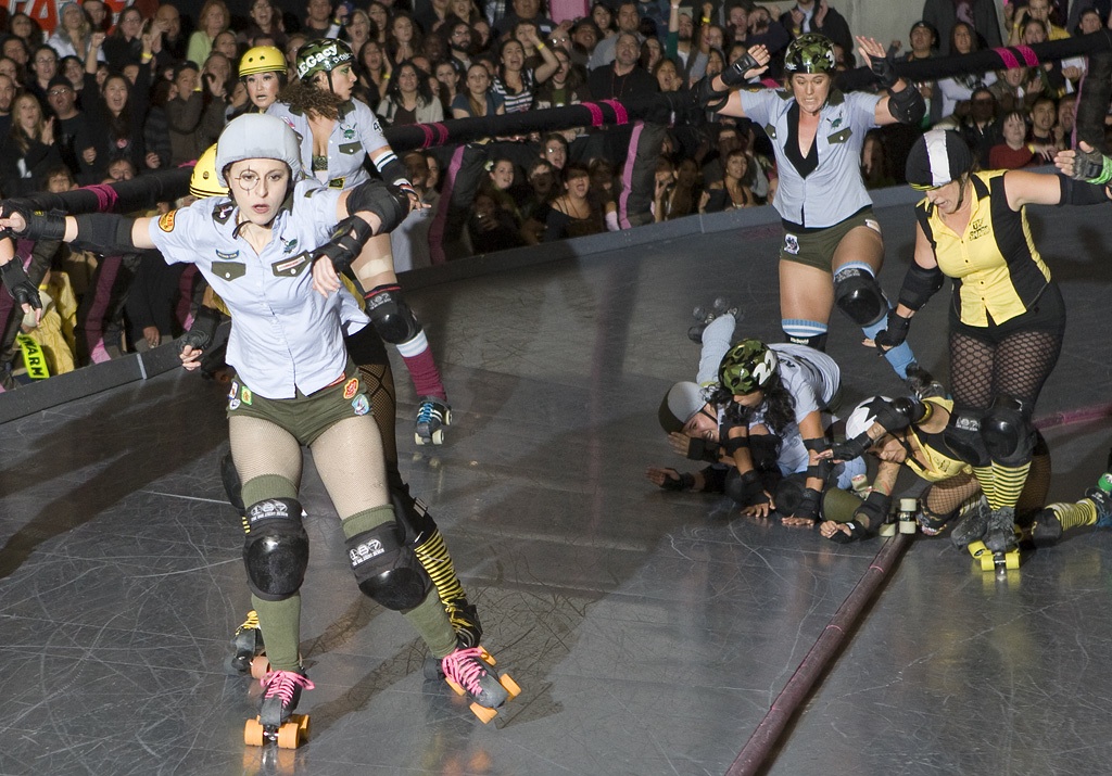 Skaters fall to the floor during the LA Derby Dolls 2009 championship game. (photo by Michael Zampelli)
