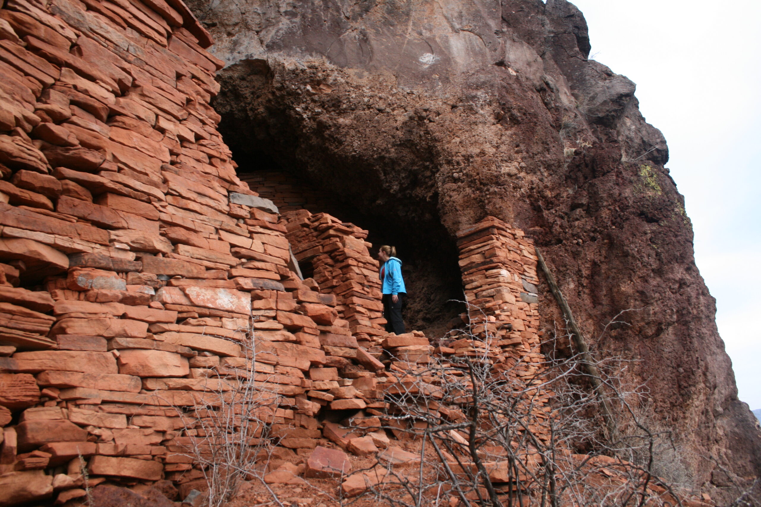 Wendy explores Verde Hohokam cliff dwelling ruins.