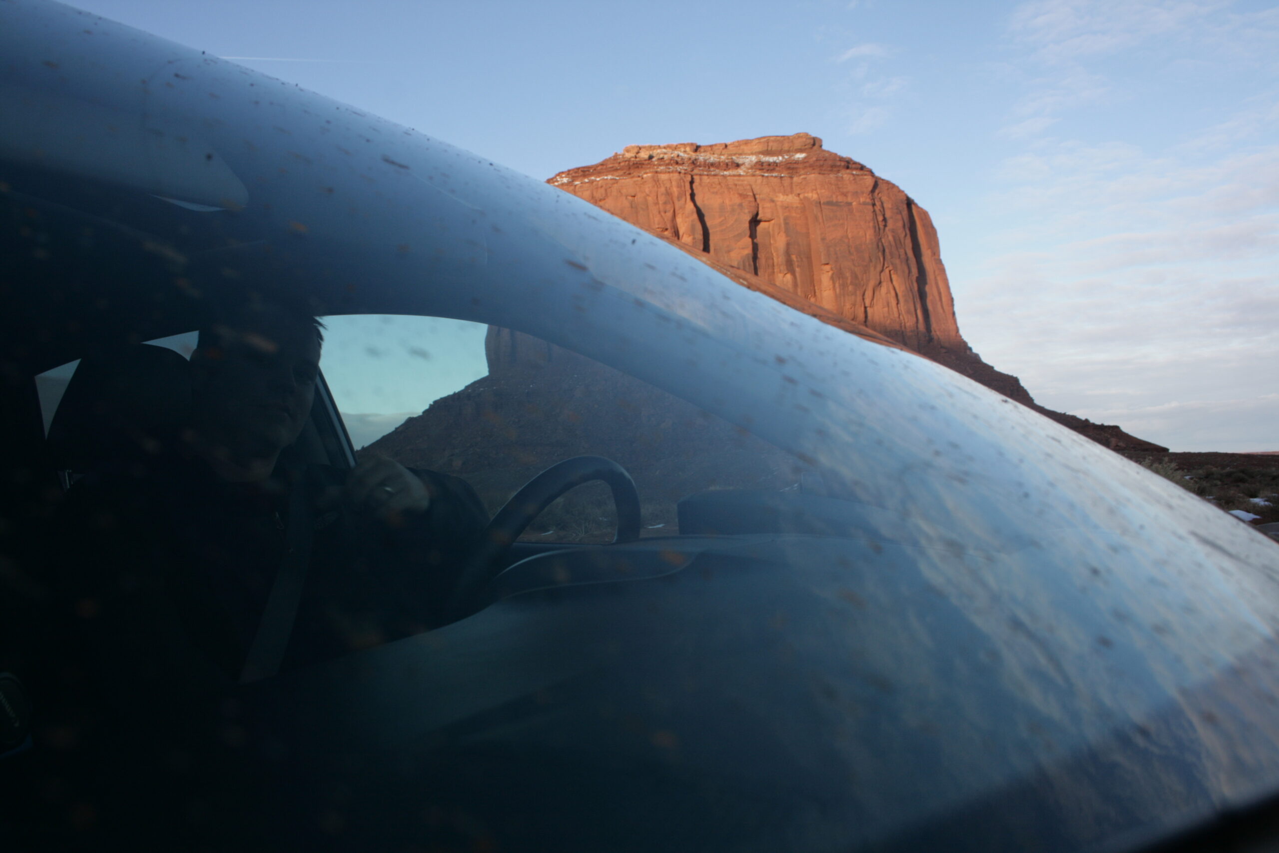 Rich steers our car through a muddy windshield in Monument Valley.