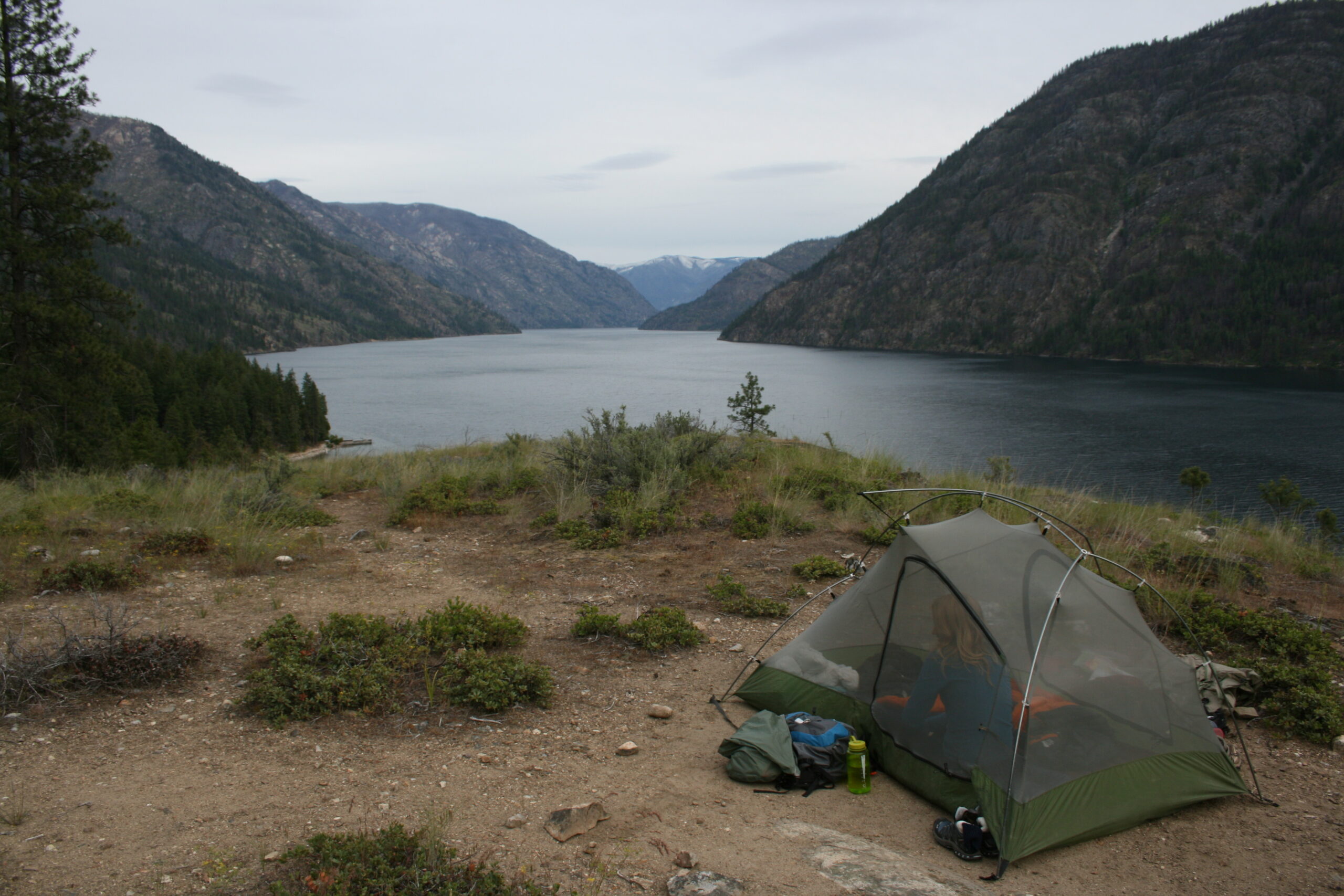 A tent sits on a ridge above Lake Chelan.
