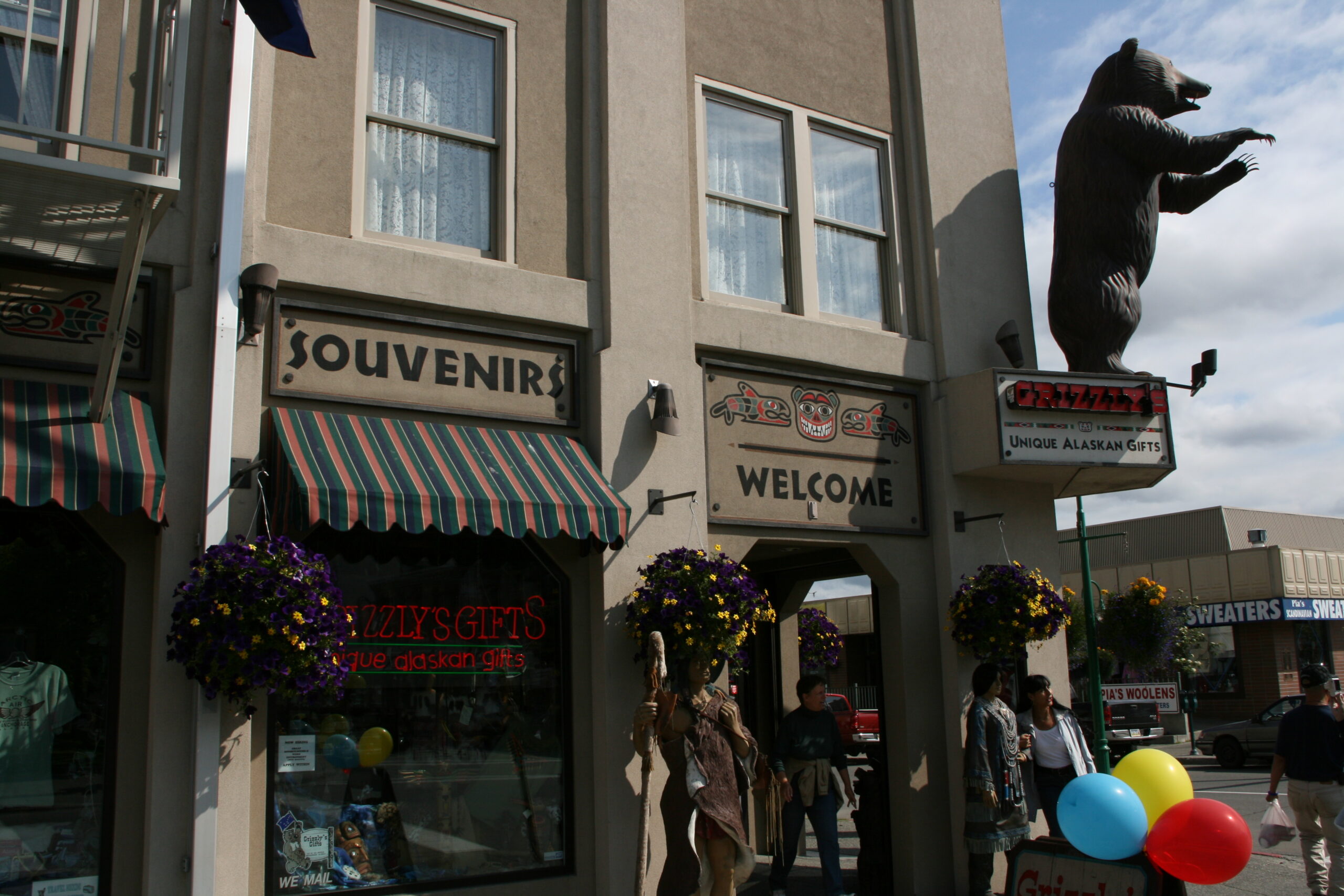 A plastic bear greets customers of Grizzly's Unique Alaskan Gifts in downtown Anchorage, Alaska.