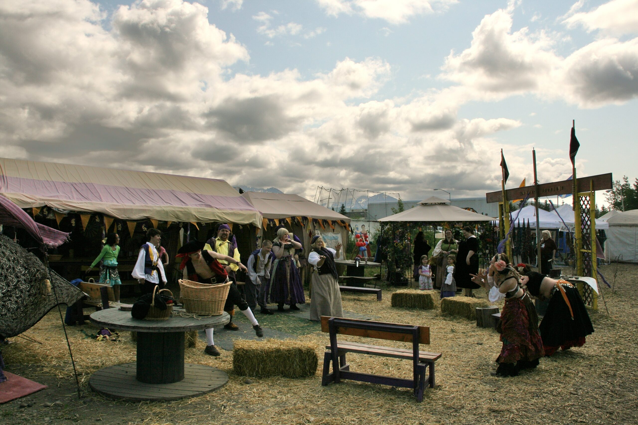 Three Barons Renaissance Fair attendees learn how to belly dance.