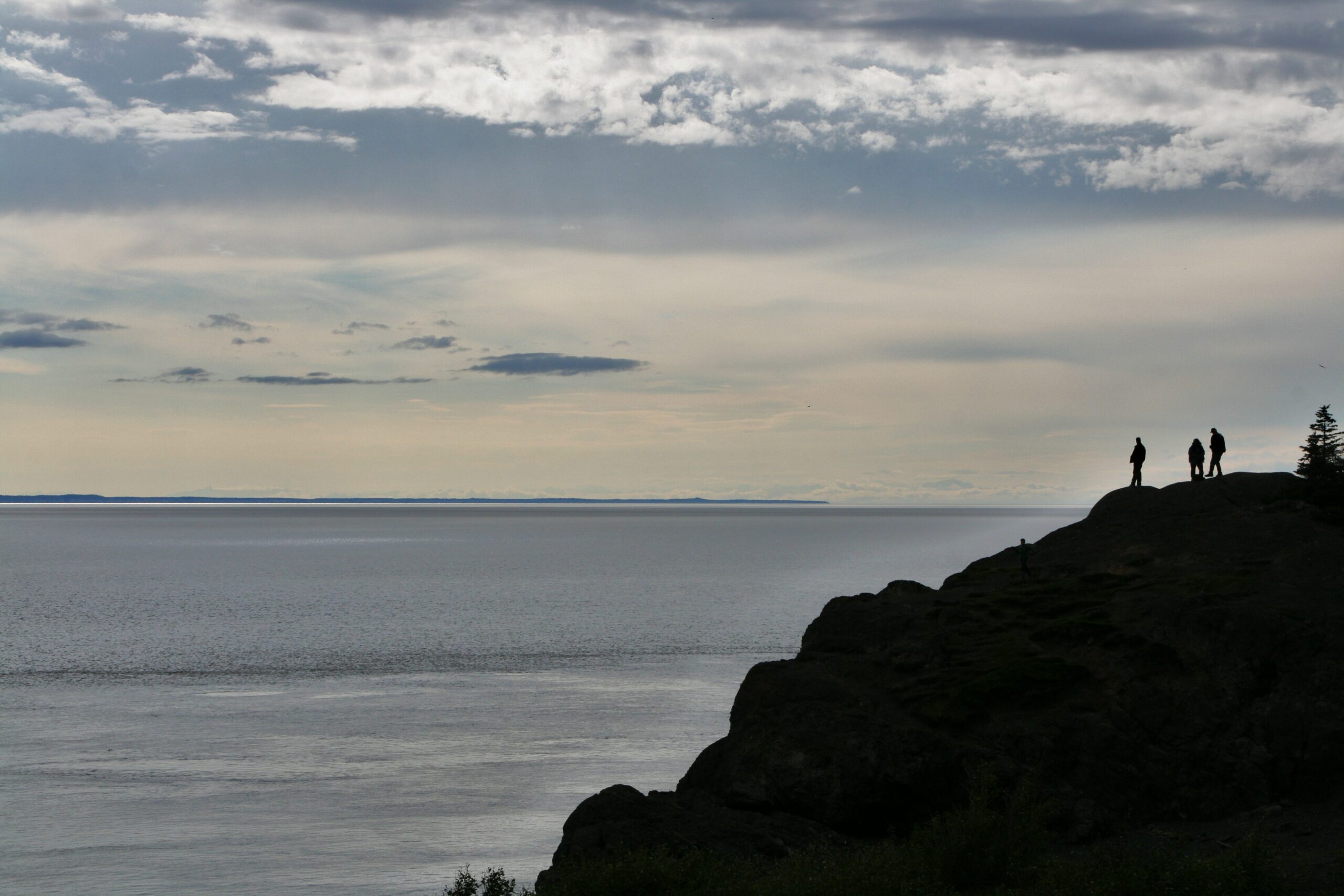 Tourists look out at the Cook Inlet from Beluga Point on Alaska's Seward Highway.