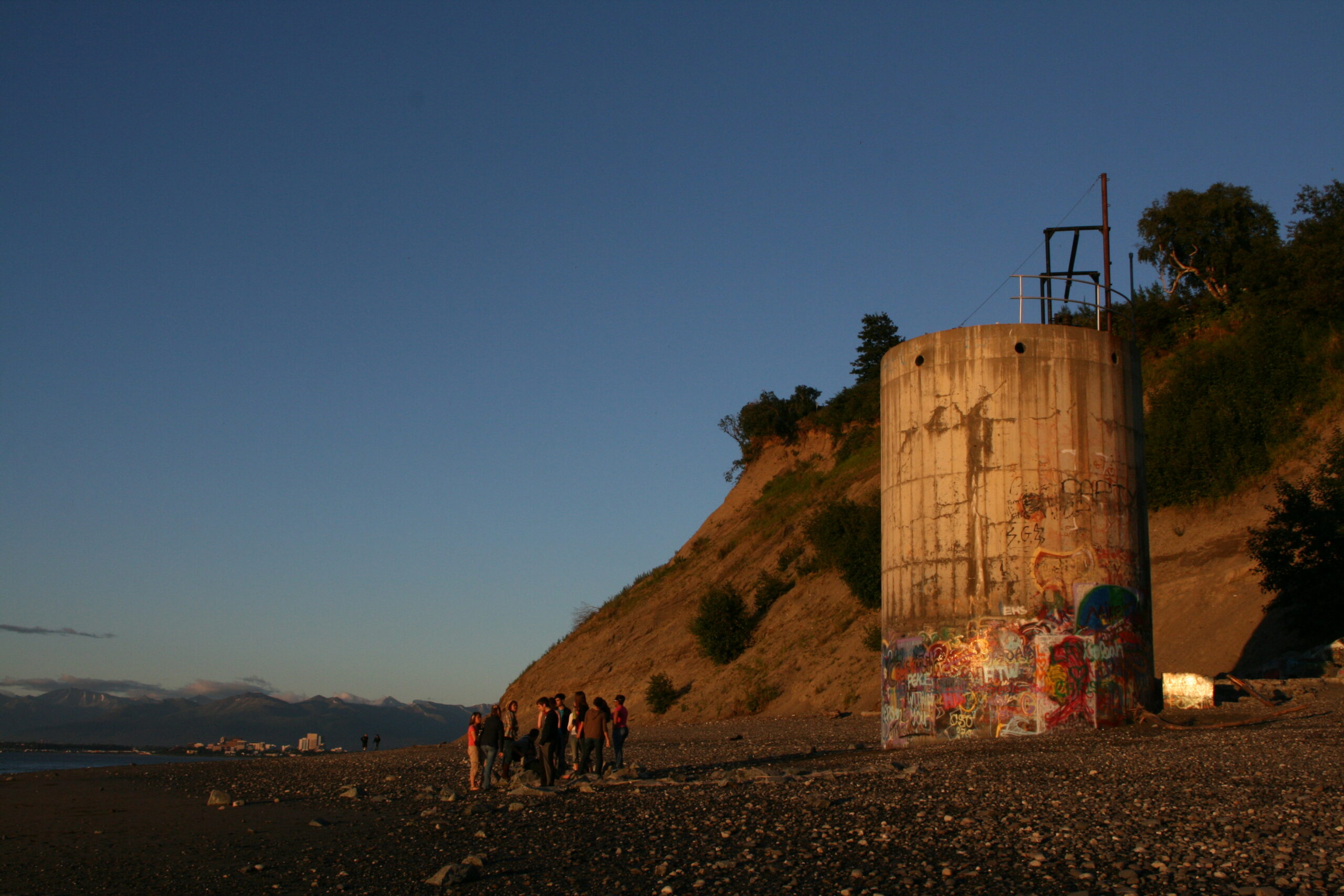 Teenagers congregate at night on the beach at Point Woronzof near the Coastal Trail in Anchorage, Alaska.