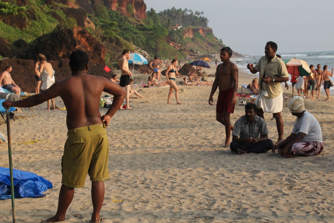 Indian men ogle Western women on a beach in Varkala, India.