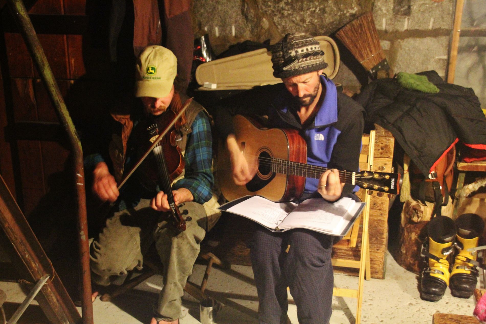 Caretakers at the Ostrander ski hut treat guests to a fiddle and guitar concert.