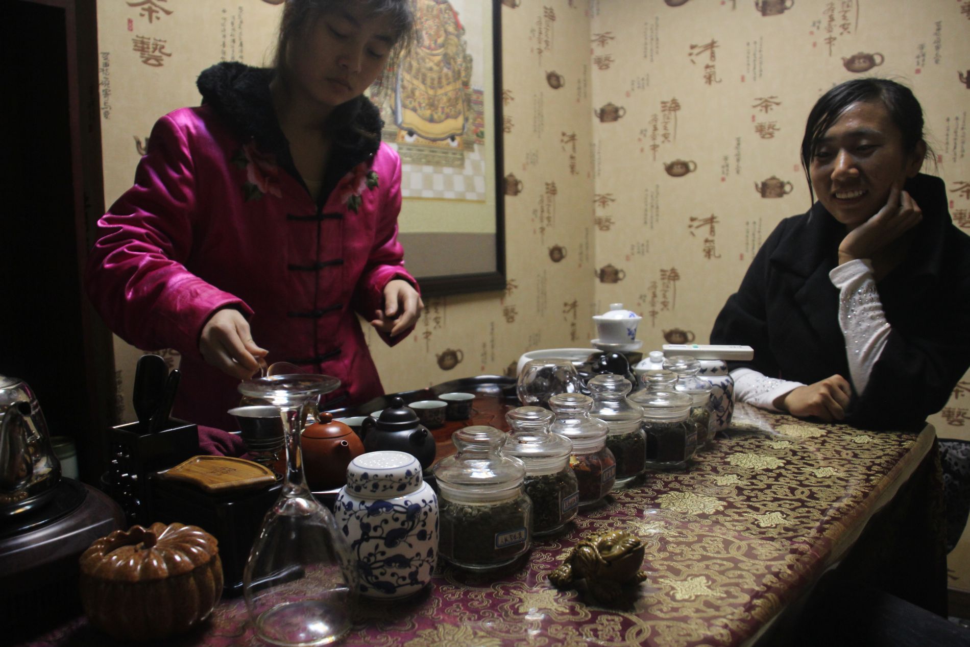 A woman pours tea during Shanghai's well-known tea ceremony con.