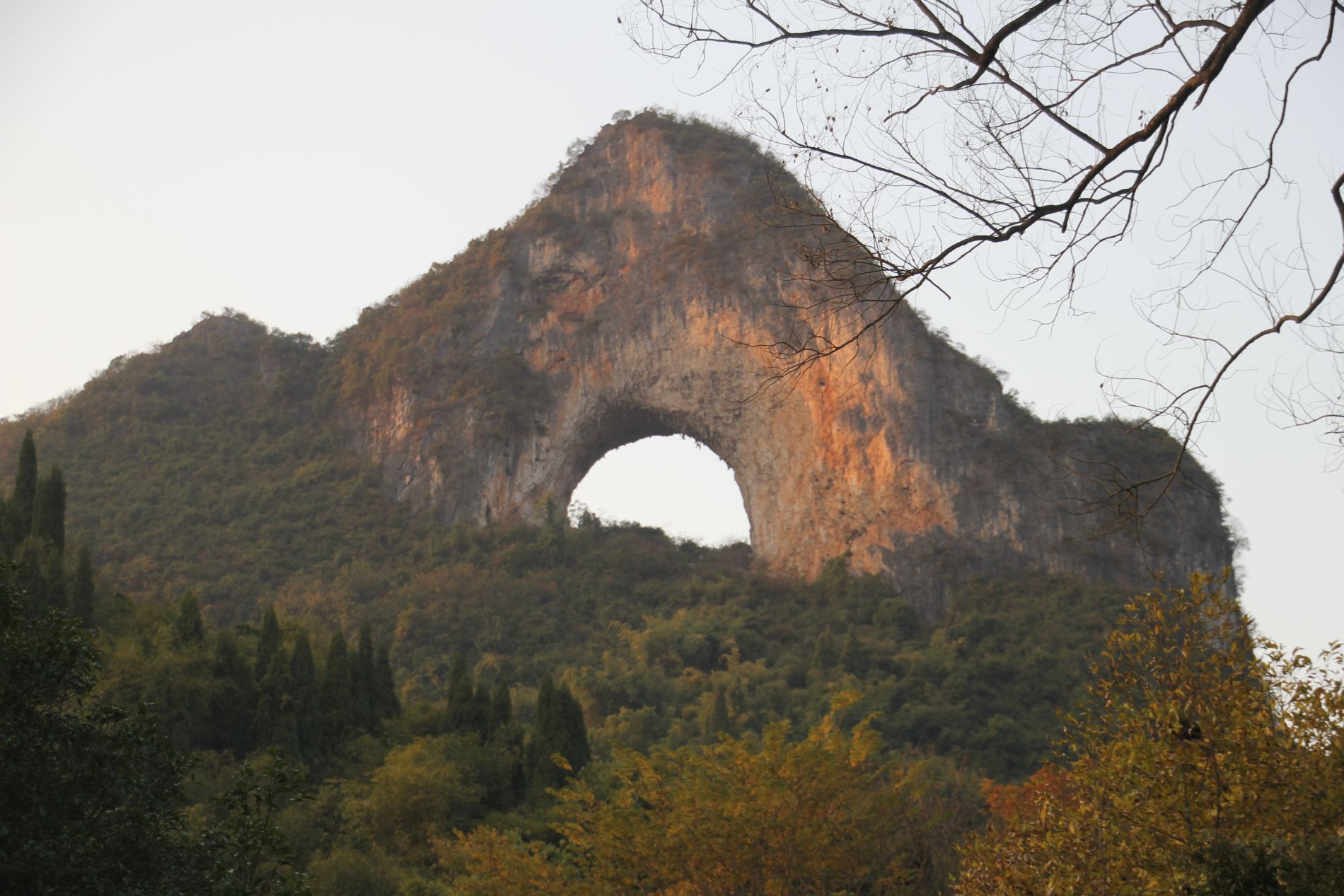 Orange light makes Moon Hill glow at sunset near Yángshuò, GuÄƒngxÄ«, China.