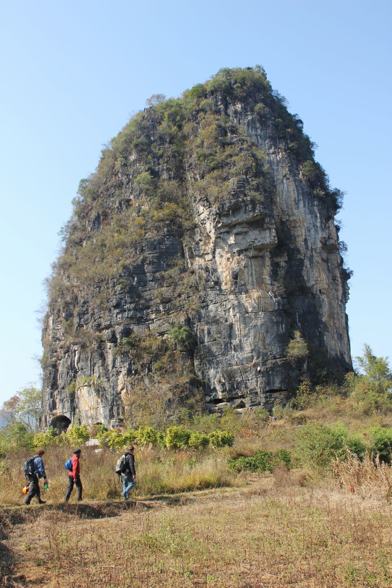 Climbers walking toward The Egg in Yángshuò, Guangxi, China.