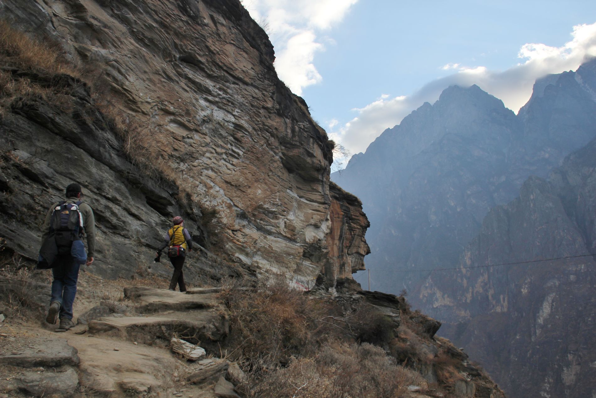 Hikers trek through China's Tiger Leaping Gorge.