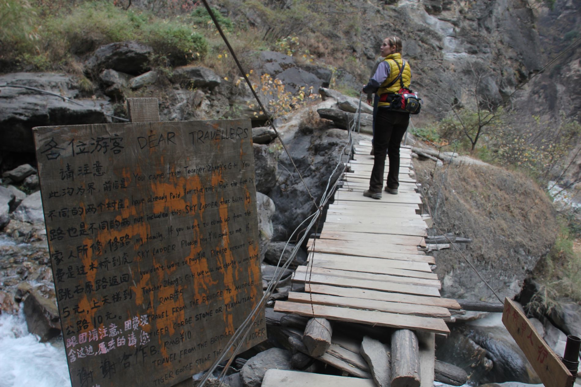 Illegal signs used to extort money from tourists dot the trail in China's Tiger Leaping Gorge.