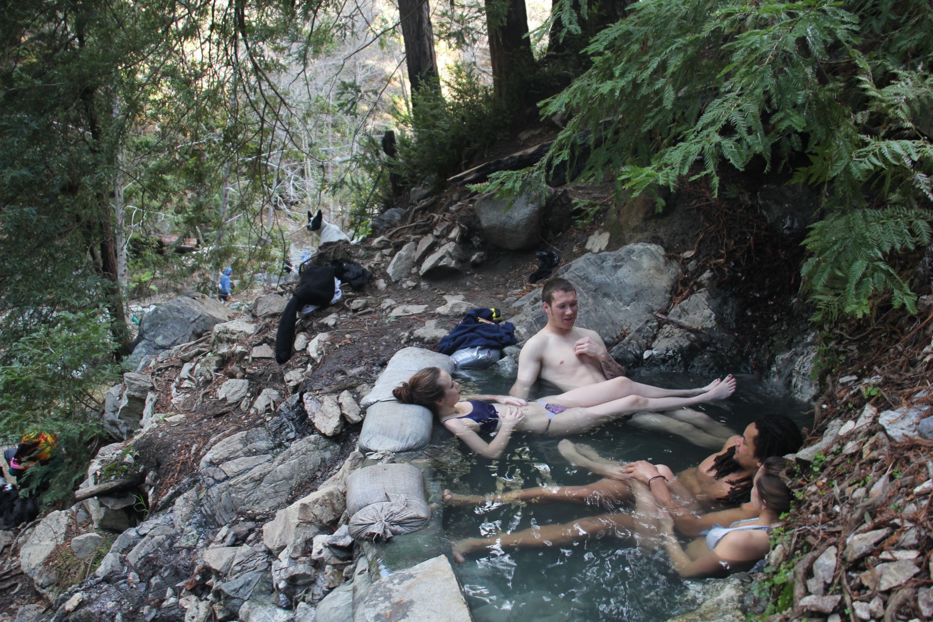 Couples relax in one of the Sykes Hot Springs in Big Sur, California.