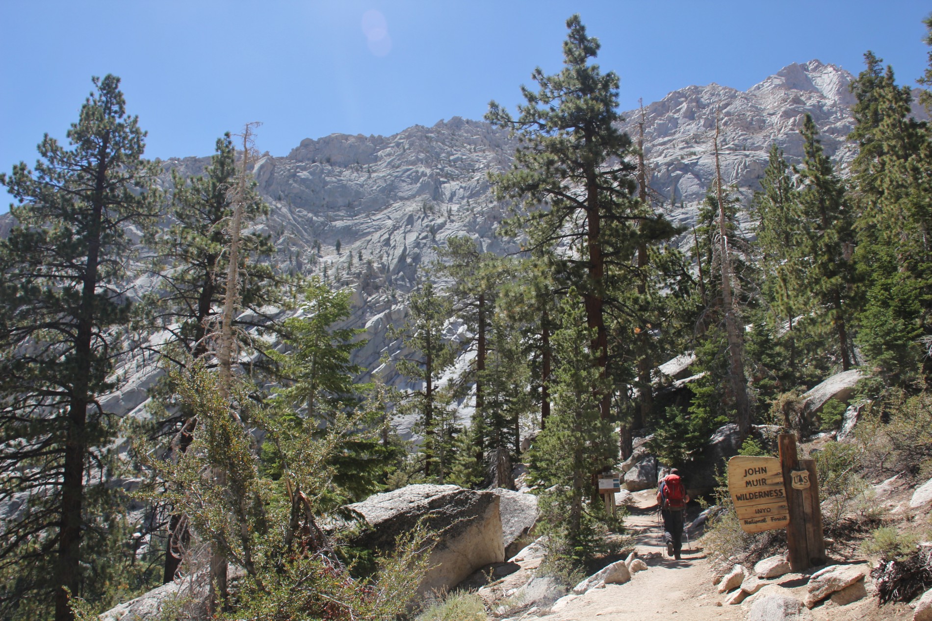 A hiker enters the John Muir Wilderness.