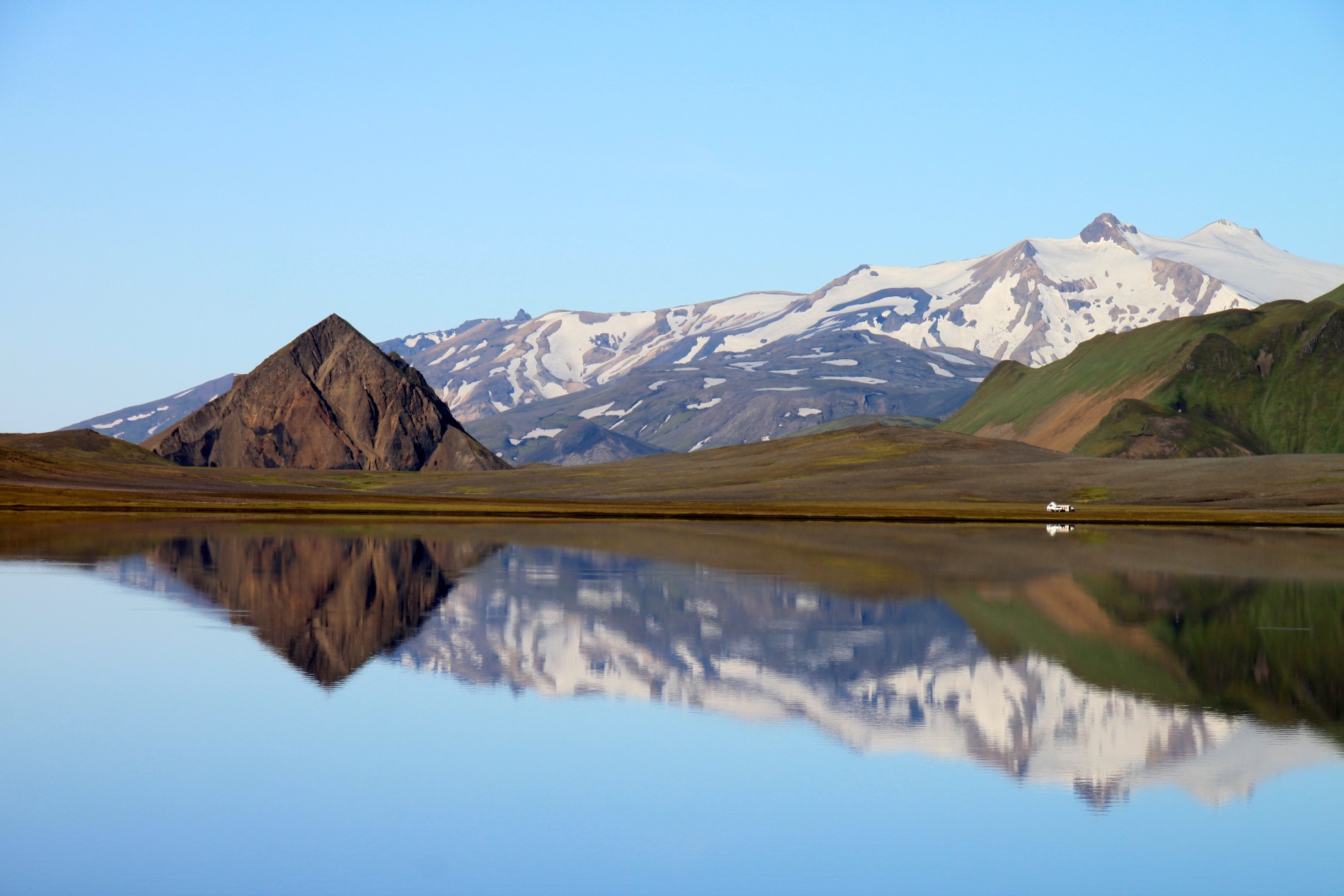 Álftavatn Lake reflects the surrounding mountains.