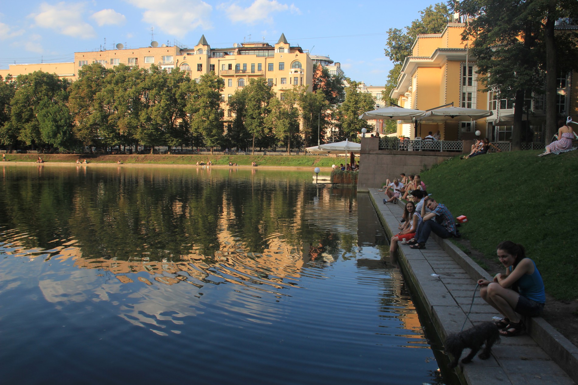 Russians relax on the shore of Moscow's famous Patriarshiye Pond.