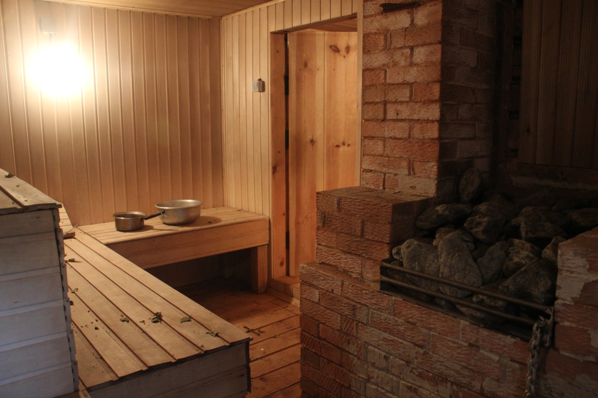 Inside a Russian banya, wooden benches wait for bathers.