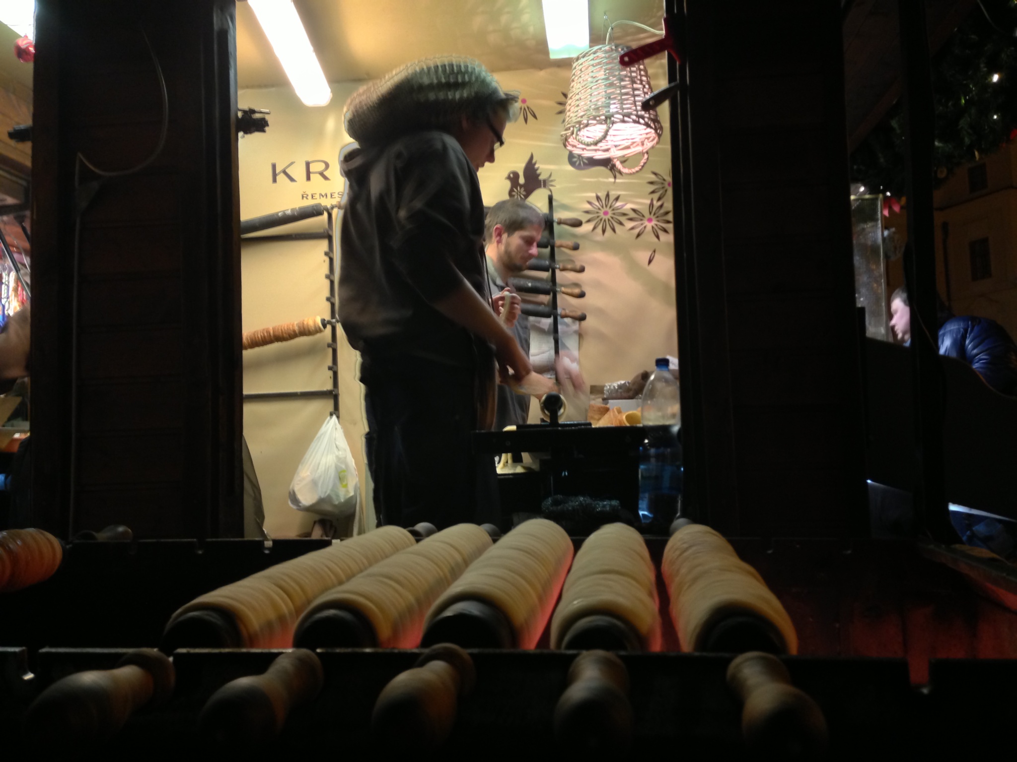 Trdelniks roast in the evening in Prague's Old Town Square.