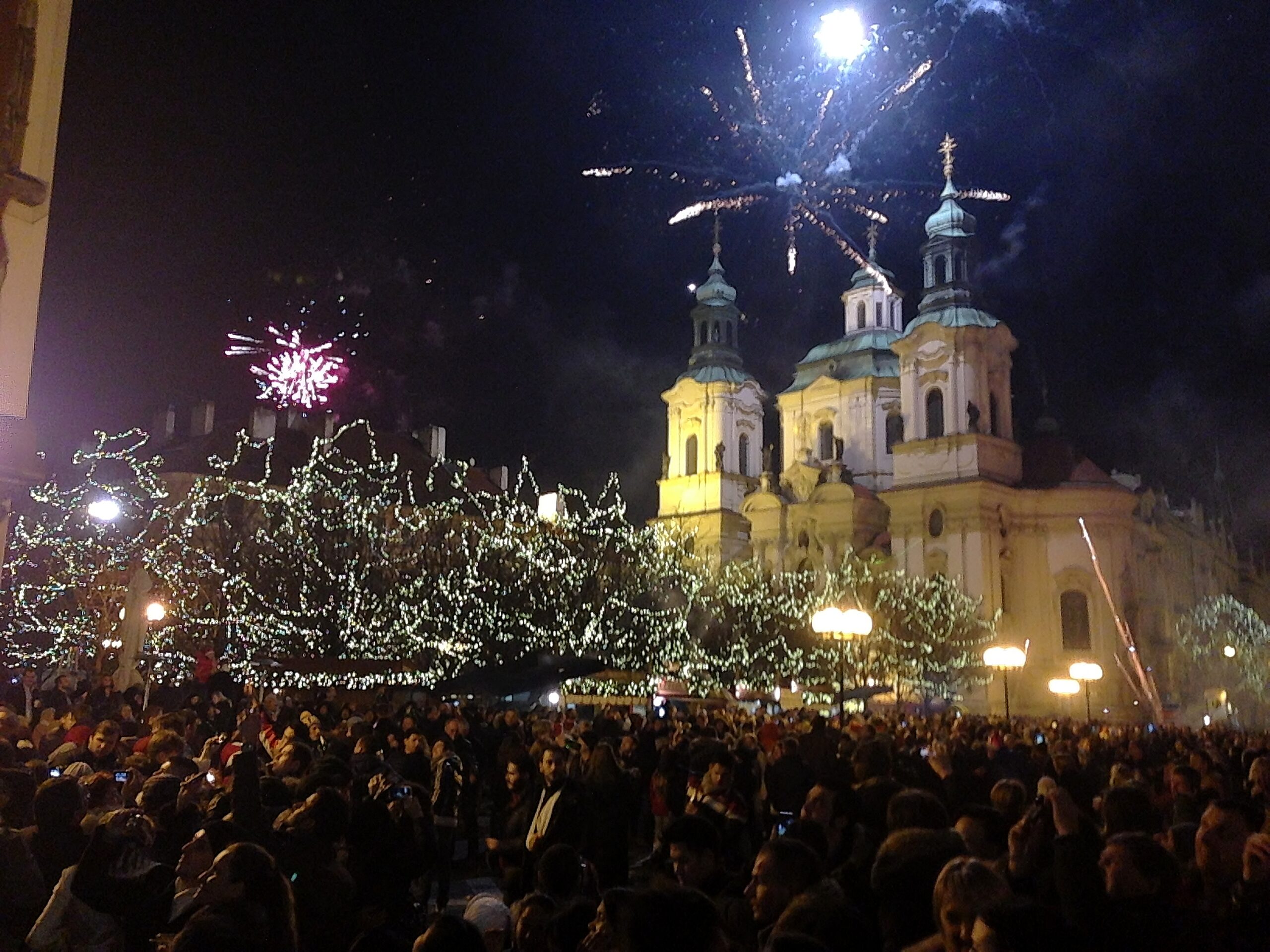 Amateur fireworks shows dazzle visitors to Prague&#039;s St. Nicholas Church in Old Town Square on New Year&#039;s Eve, 2012.