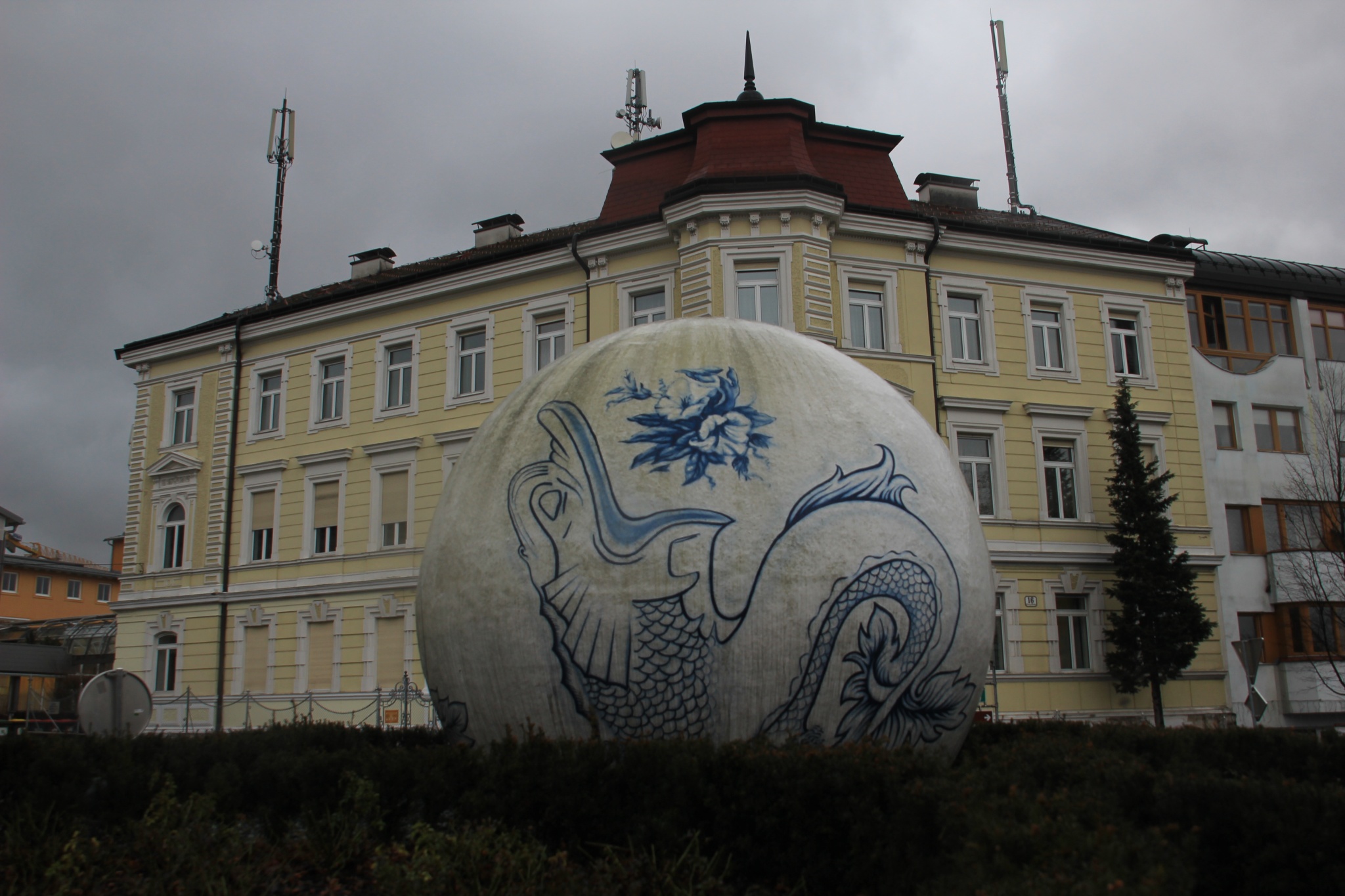 A dragon scupture sits at an intersection in Gmunden, Austria.