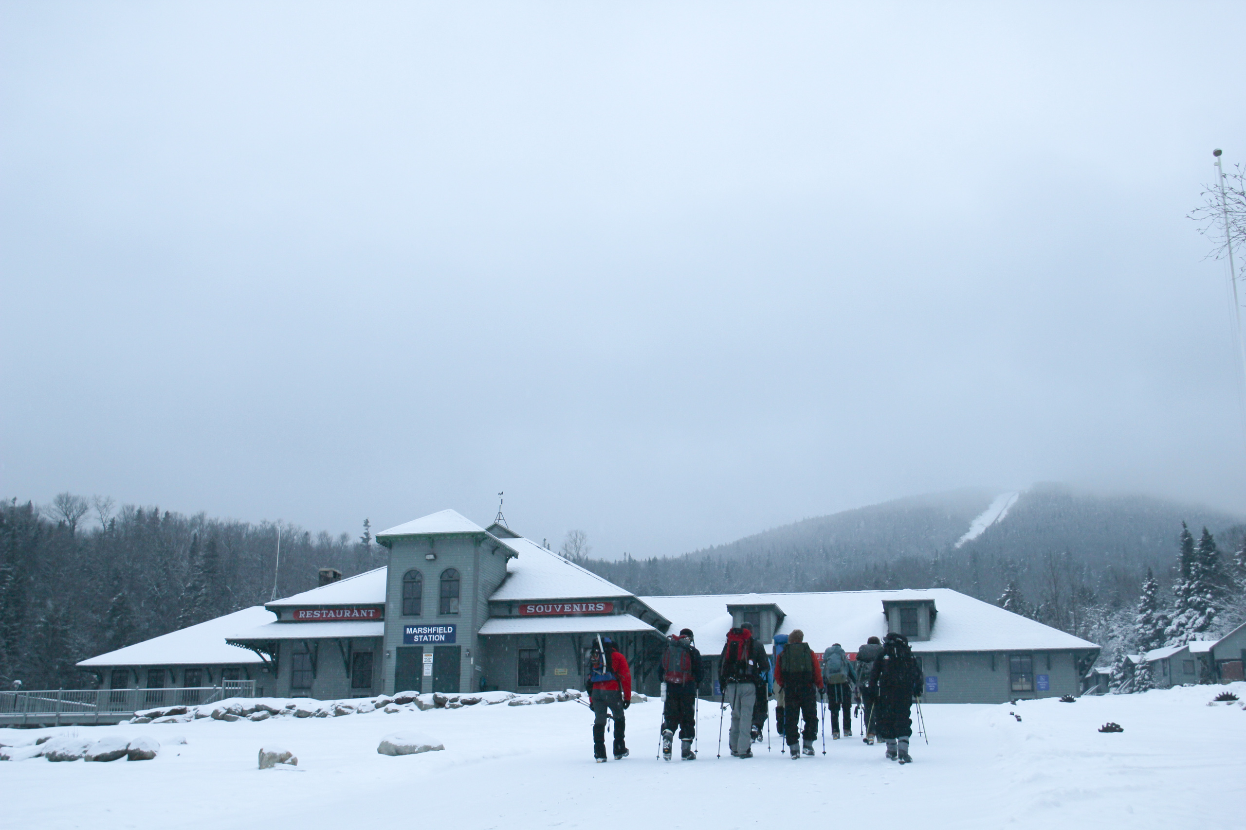 Hikers head toward the Ammonoosuc Ravine Trailhead near Marshfield Station.