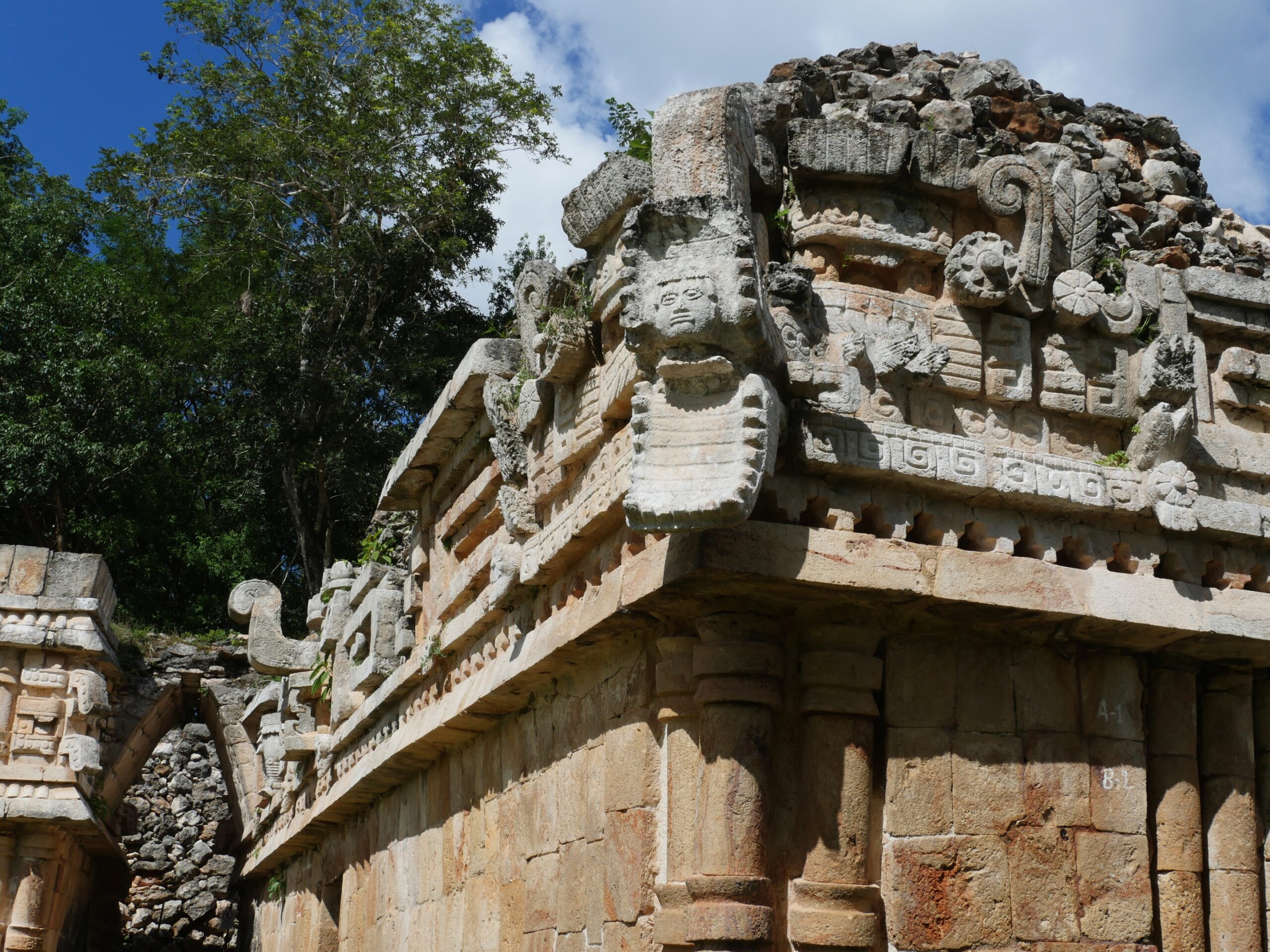 The face of the Mayan rain god Chac looks out from the Palace at LabnÃ¡ on the Ruta Puuc in YucatÃ¡n, Mexico.