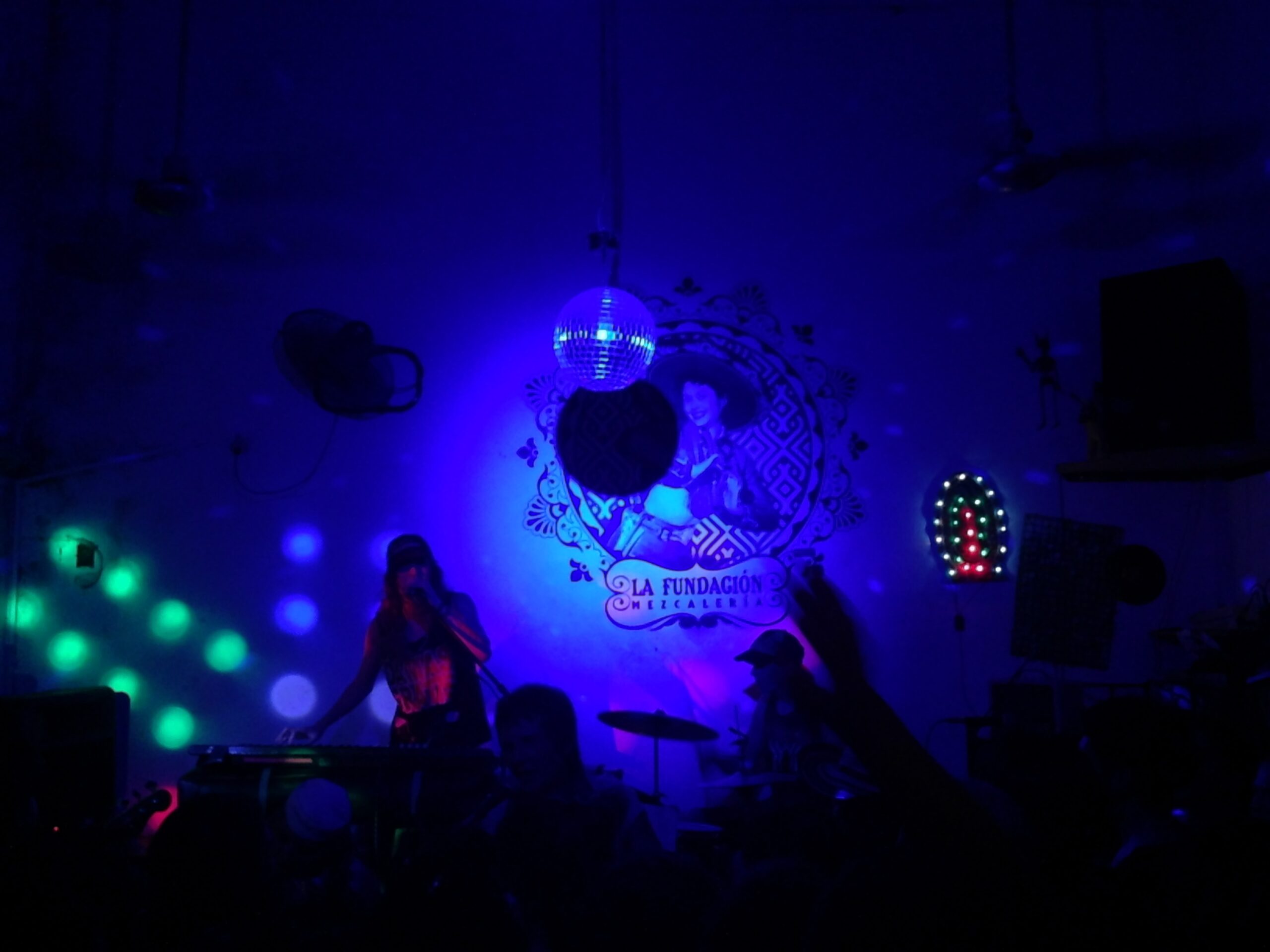 Dancers enjoy music at La Fundación Mezcalería bar in Mérida, Mexico.