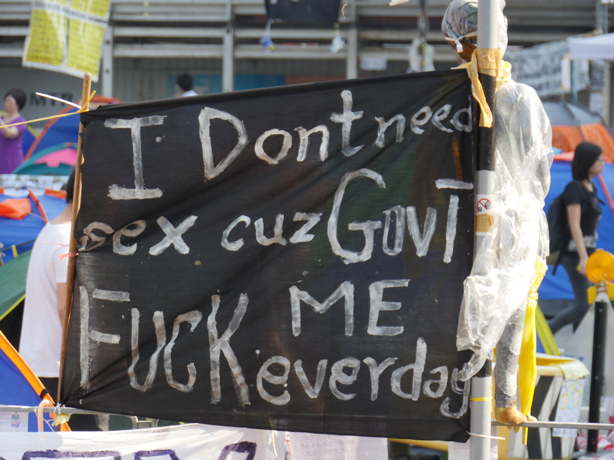 A sign complains about the government at Occupy Central.