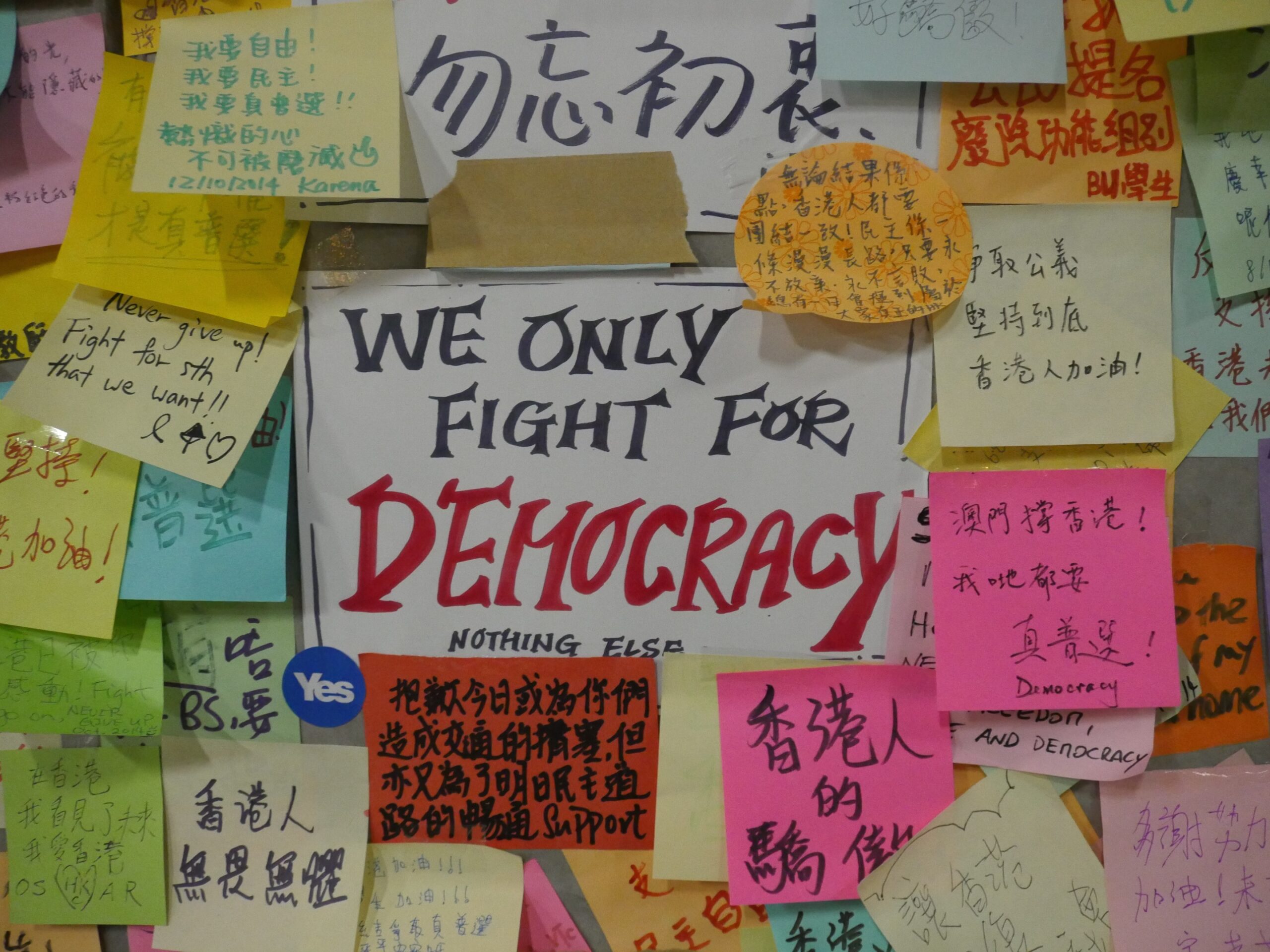 A sign on the Lennon Wall Hong Kong explains the protesters' mission.