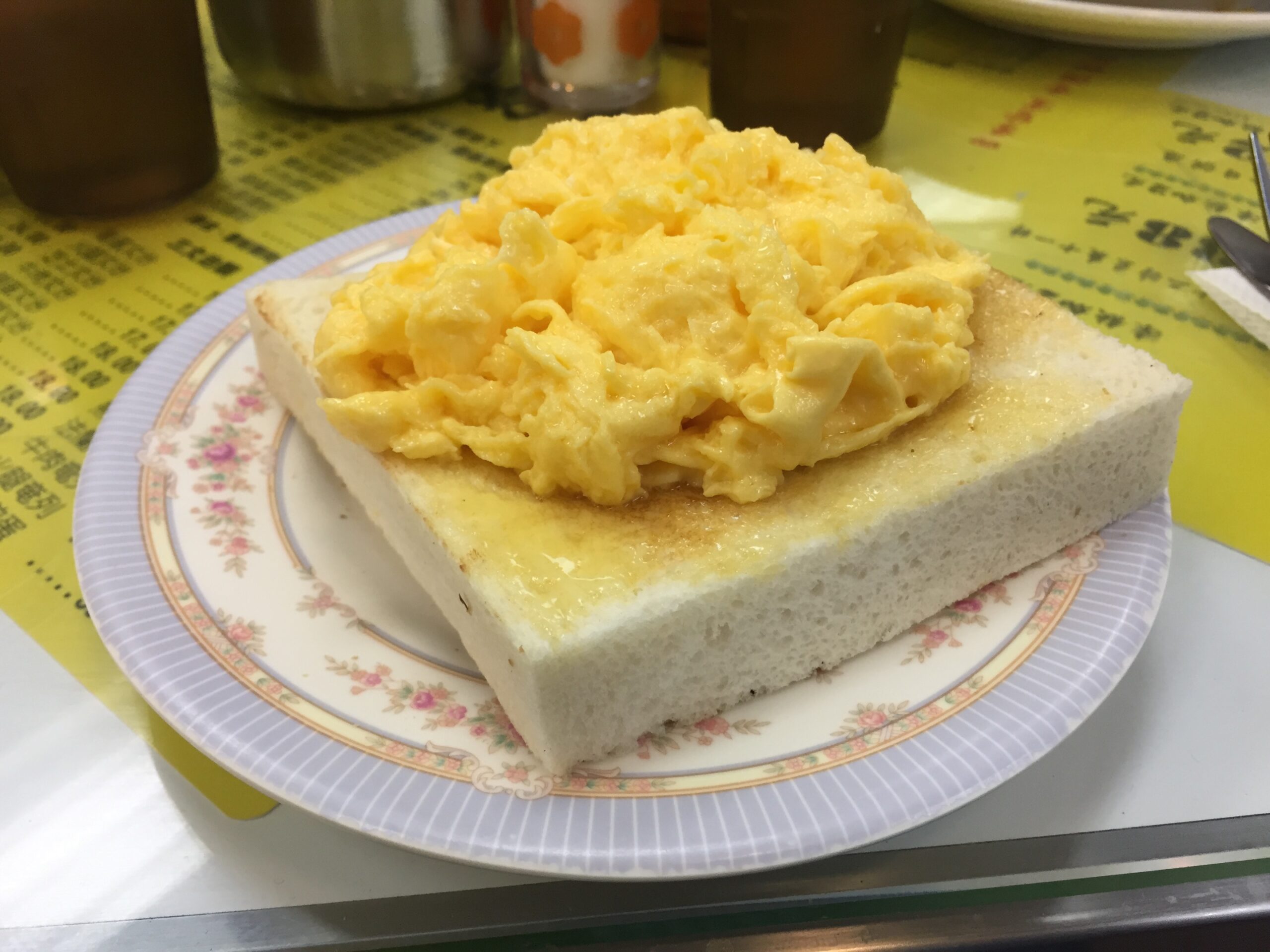 Fluffy scrambled eggs and toast are the Australia Dairy Company's signature dish.