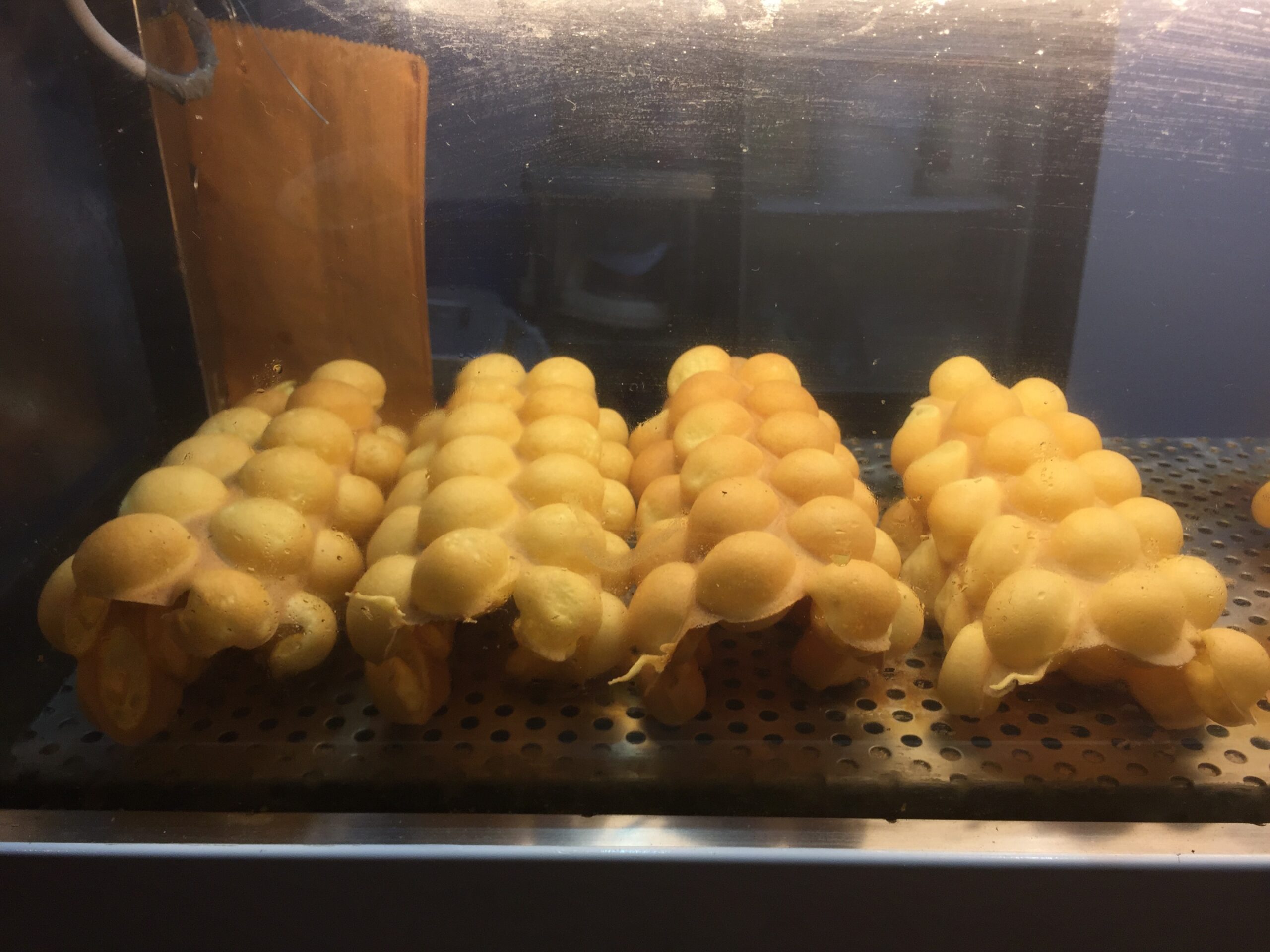 Tasty egg waffles are a snack found at most street food vendors in Hong Kong.