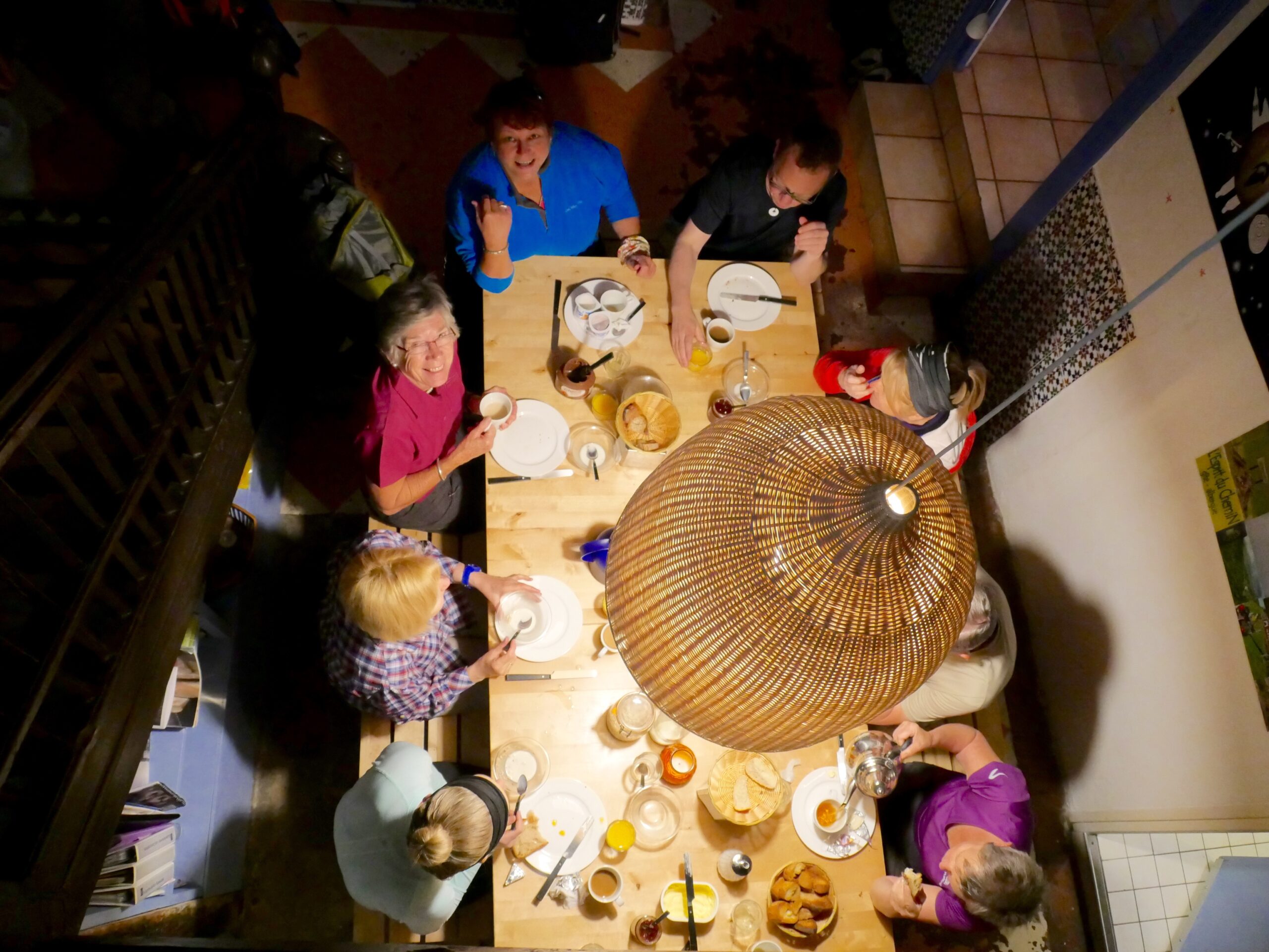 Pilgrims eat breakfast at an albergue in Saint-Jean-Pied-de-Port, France before beginning their walk on the Camino de Santiago.