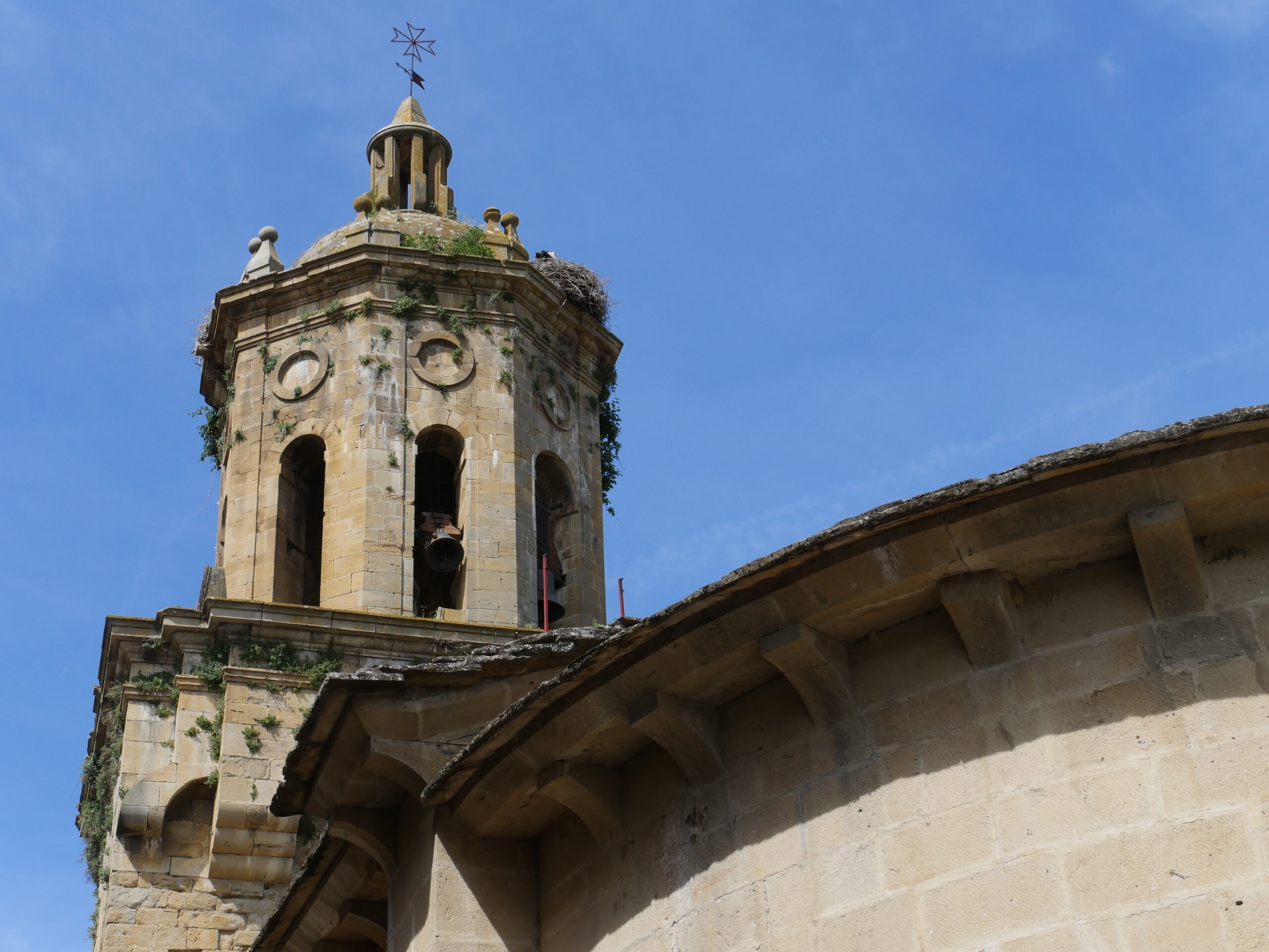 The El Crucifijo Church in Puente la Reina, Spain has a large bell tower.