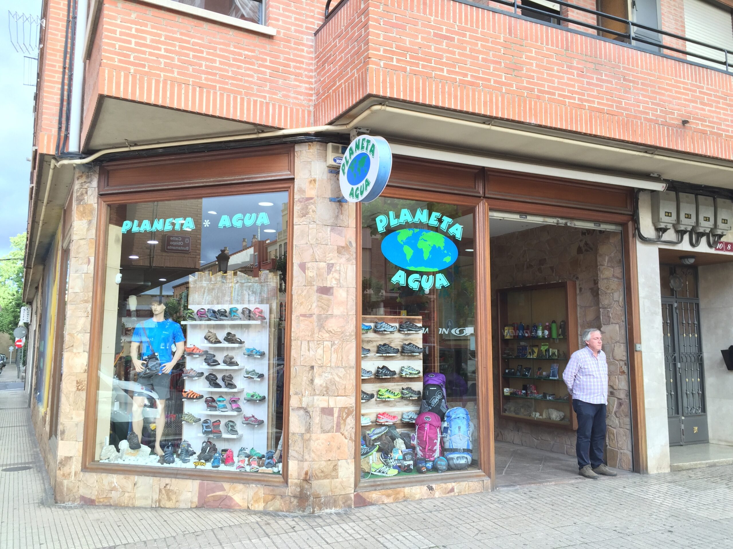 The owner of Planeta Agua stands outside the store in Logroño, Spain.