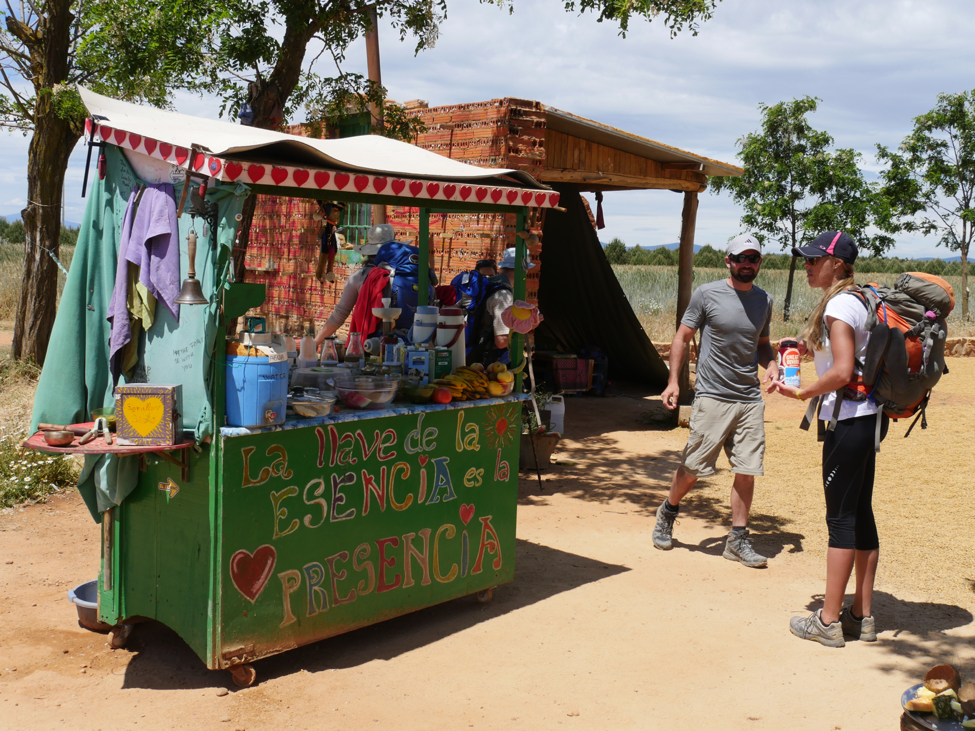 Volunteers give pilgrims free food and juice on a hill in Villares de Órbigo above Astorga, Spain.