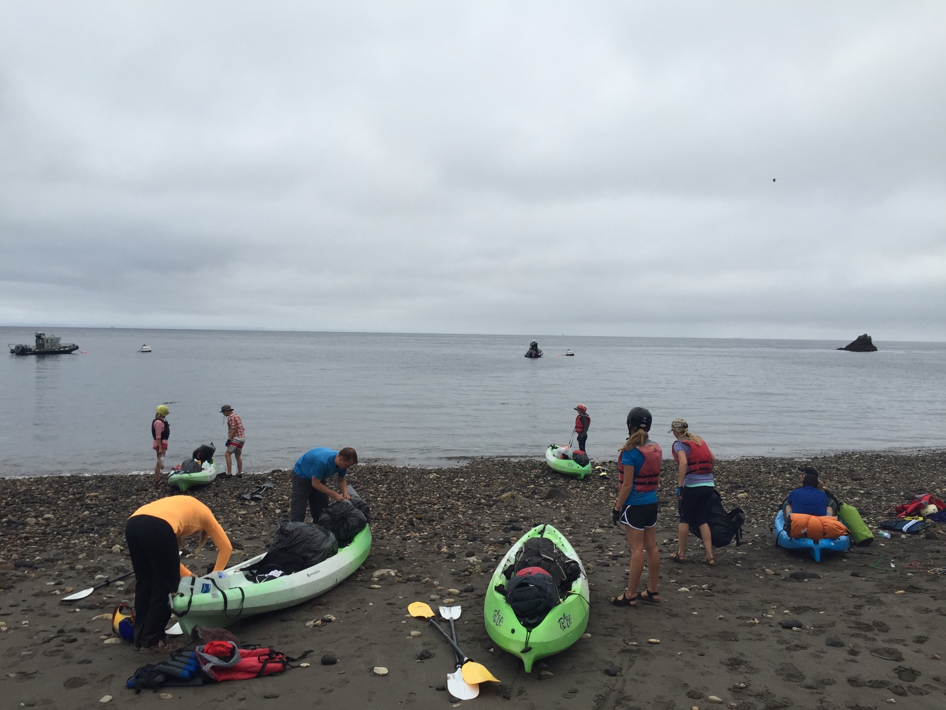 Kayakers ready their boats at Scorpion Anchorage on Santa Cruz Island, California.