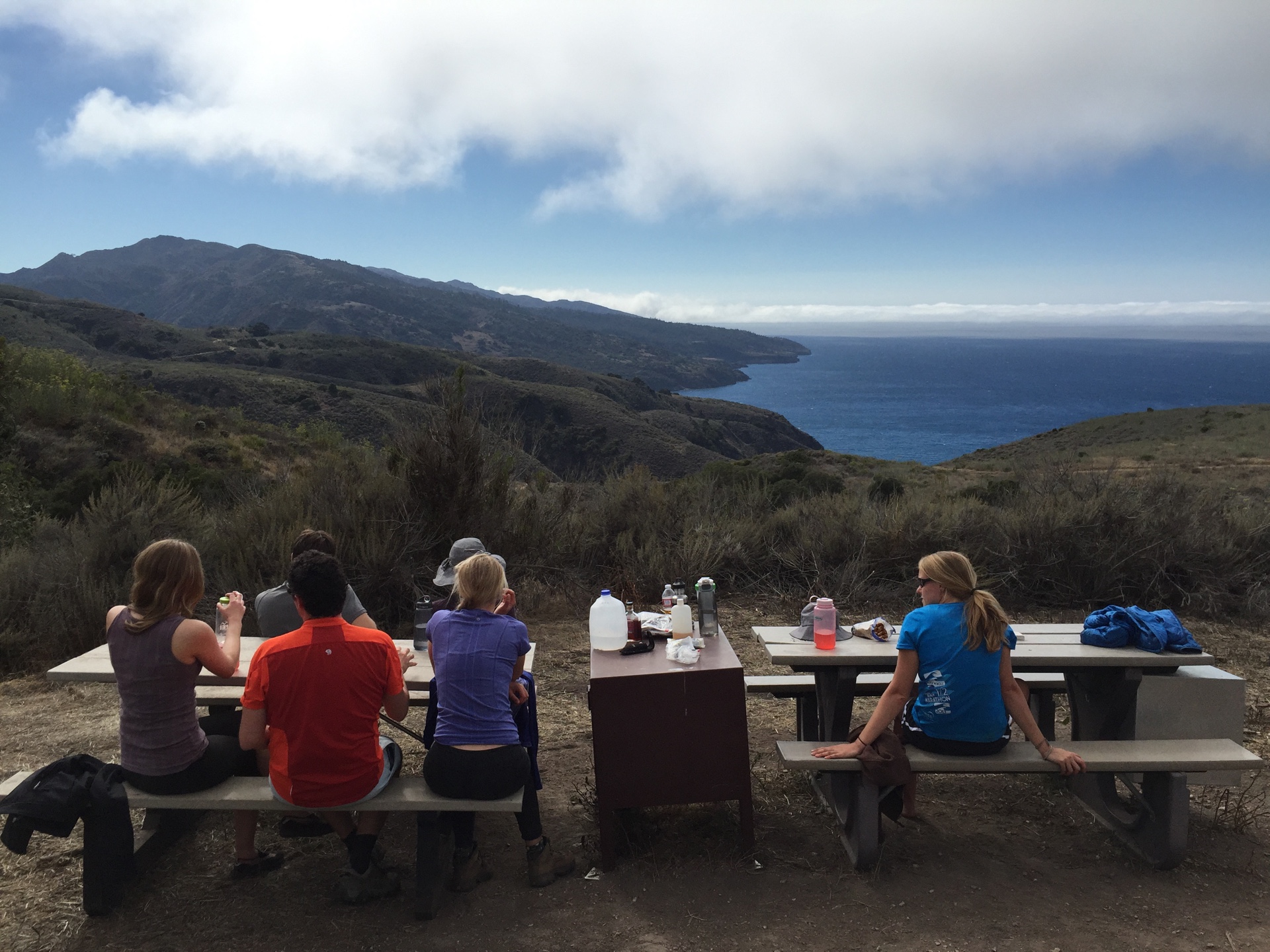 Campers enjoy the view from Del Norte Campground above Prisoner's Harbor on Santa Cruz Island, California.