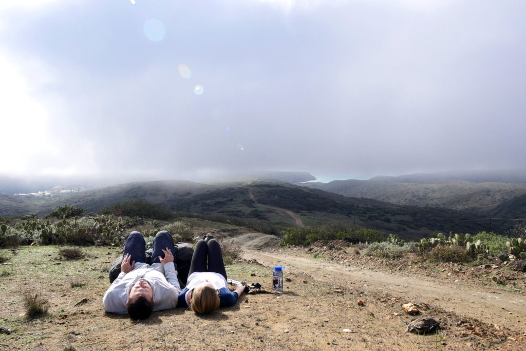 Hikers stop for a quick nap on the Trans-Catalina Trail on California's Catalina Island.