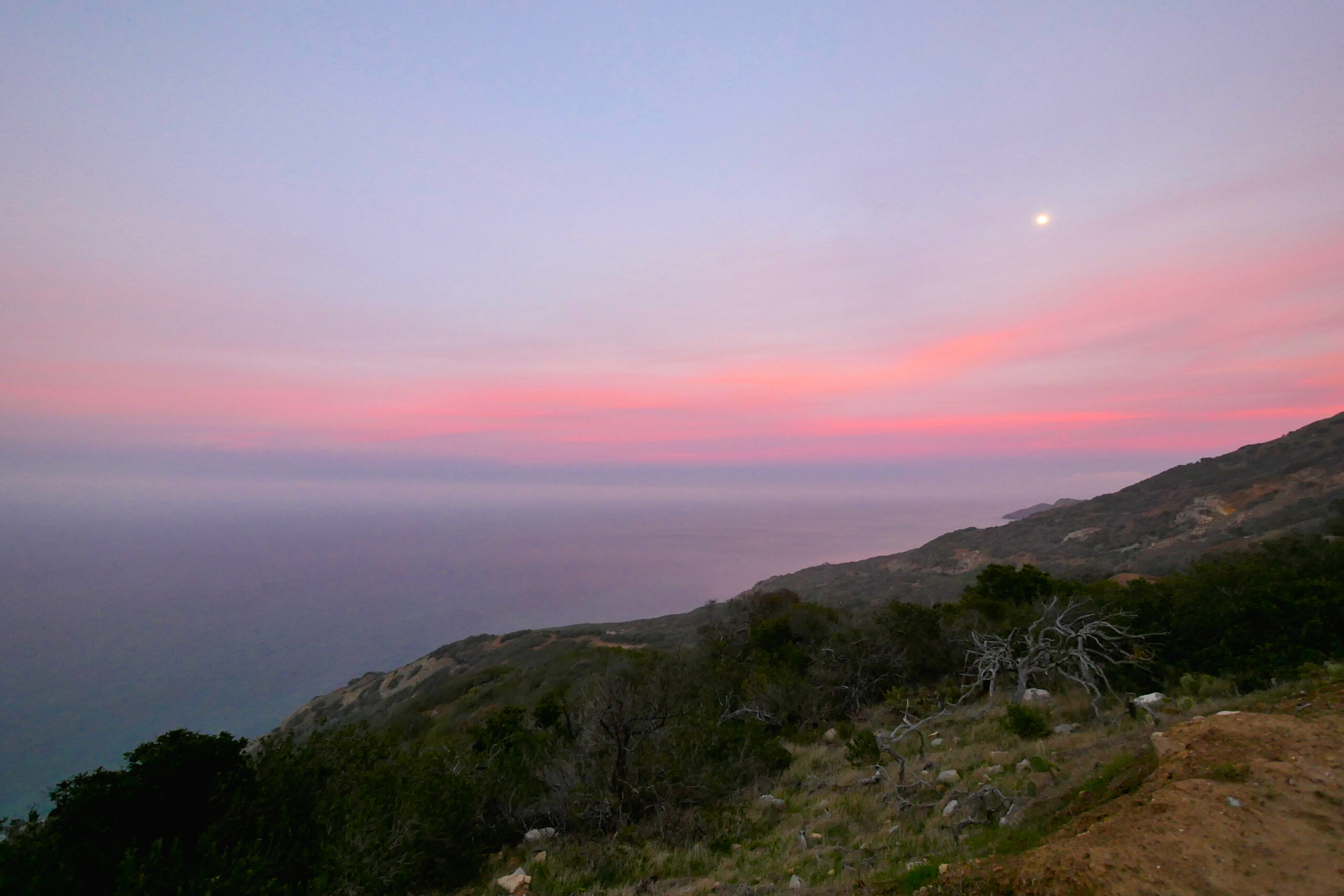 A full moon illuminates the Trans-Catalina Trail at sunset on Catalina Island, California.