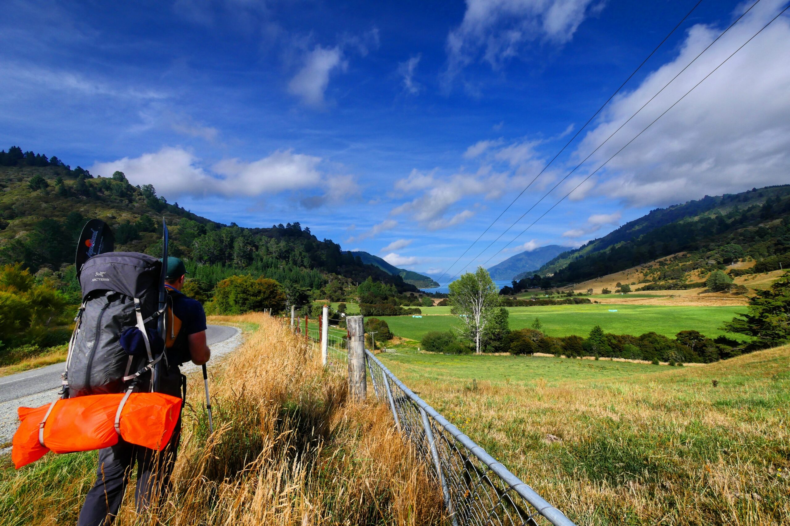 A hiker backpacks with a packraft from Queen Charlotte Sound to Mahau Sound.