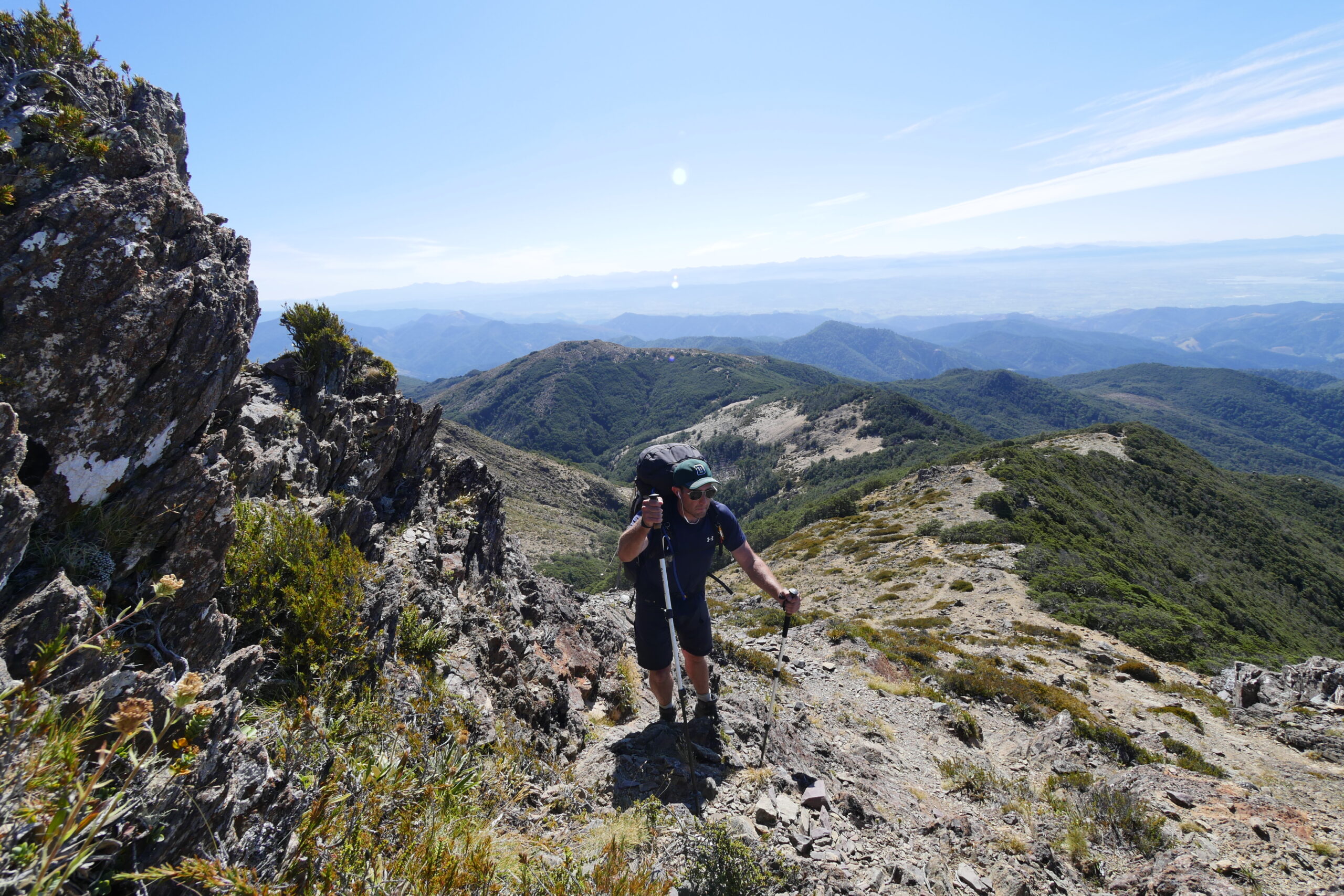 A hiker climbs toward Little Rintoul in New Zealand's Richmond Range.